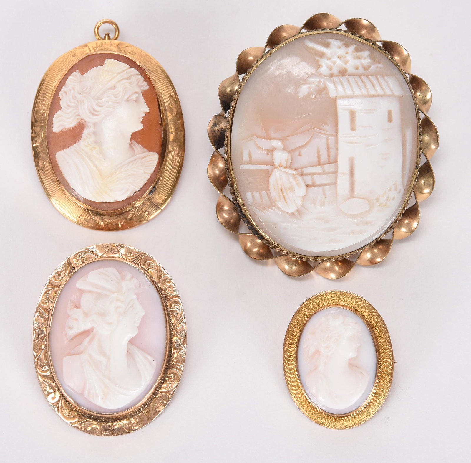 (4) Carved shell cameo brooches: (4) Carved shell cameo brooches; Sizes from 2" to 1" See photos for details; Hopper Collection, Kansas