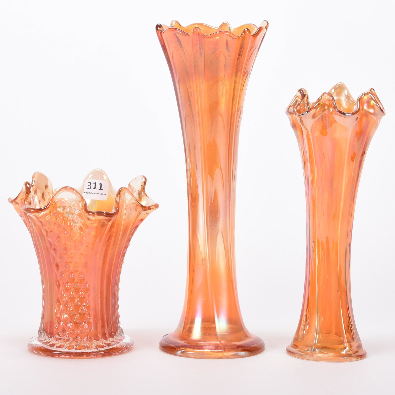 (3) Carnival Glass vases, marigold: (3) Carnival Glass vases, marigold; 11", 9", 5.75" (1) 11" Pulled Loop by Dugan; (1) 9" Butterfly & Berry by Fenton; (1) 5.75" Diamond Point Column by Fenton; Hanna Collection, Michigan