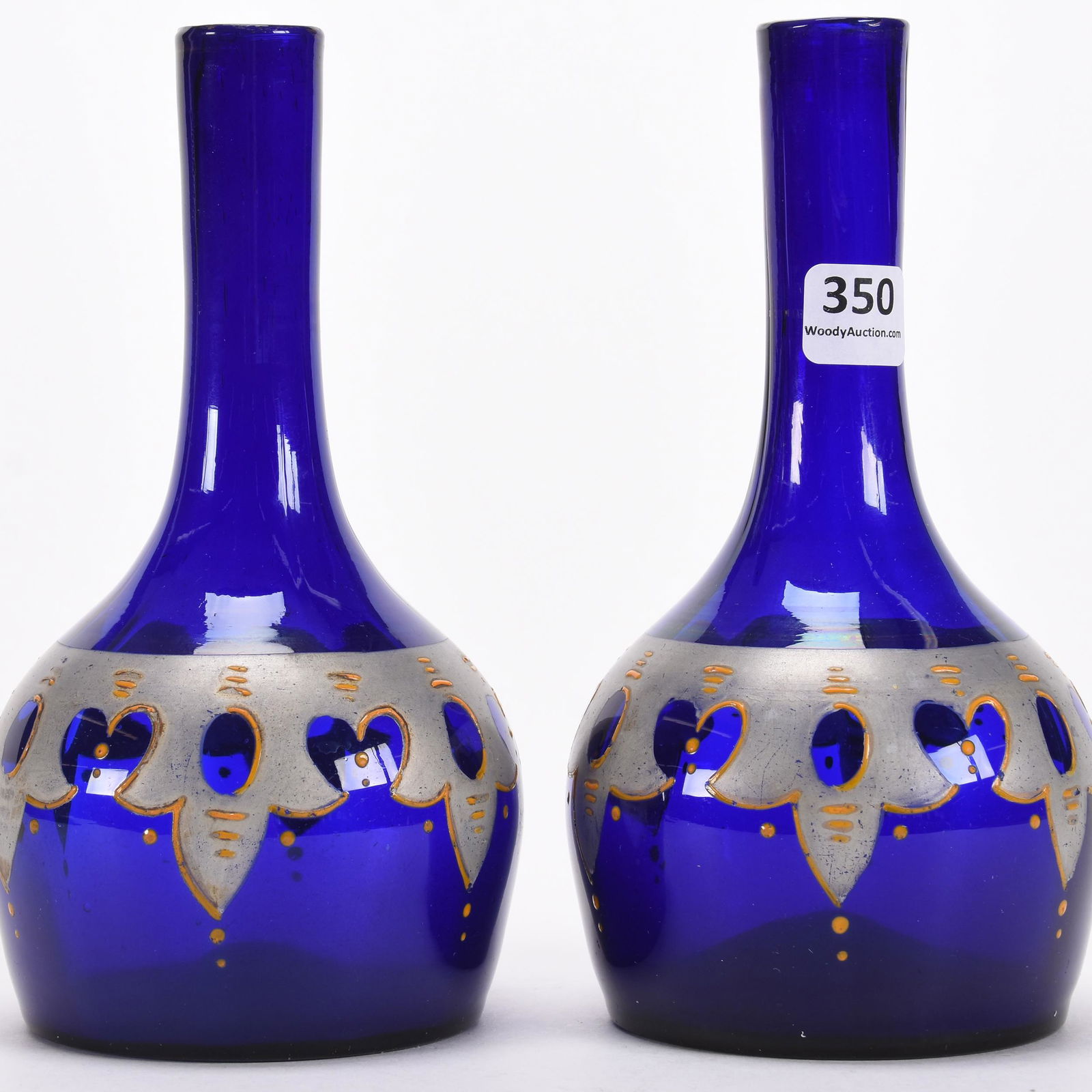 Pair barber bottles: Pair barber bottles; 7" Cobalt blue with silver design; Hale Collection, Florida