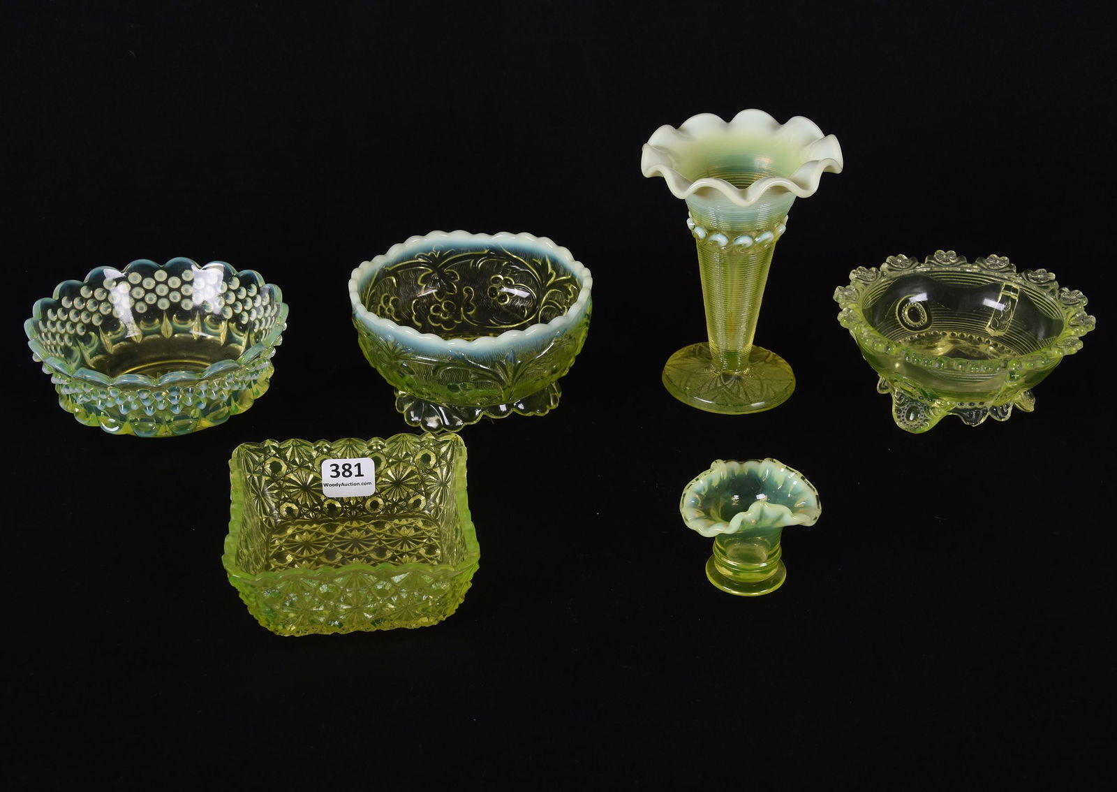 (6) Vaseline and opalescent items: (6) Vaseline and opalescent items; (1) 5" Vase, Rings with Wave Band pattern; (4) Berry/sauce dishes, one with chipping on feet; (1) 1.75" toothpick holder; Houghton Collection, Kansas