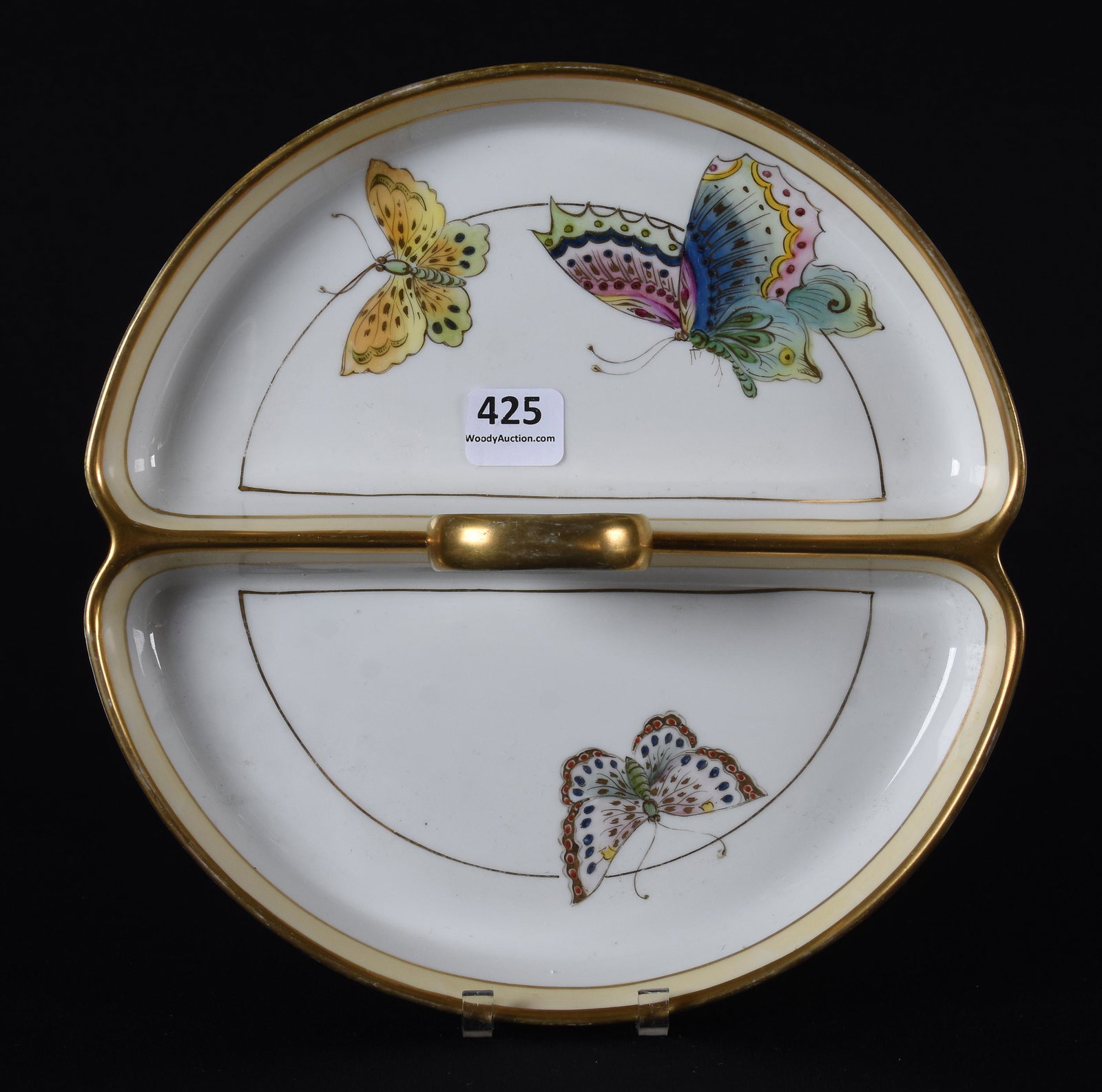Divided handled dish marked Nippon (green wreath): Divided handled dish marked Nippon (green wreath); 8" White and cream with colorful butterfly decor and gold trim highlights; Callahan Collection, Oklahoma