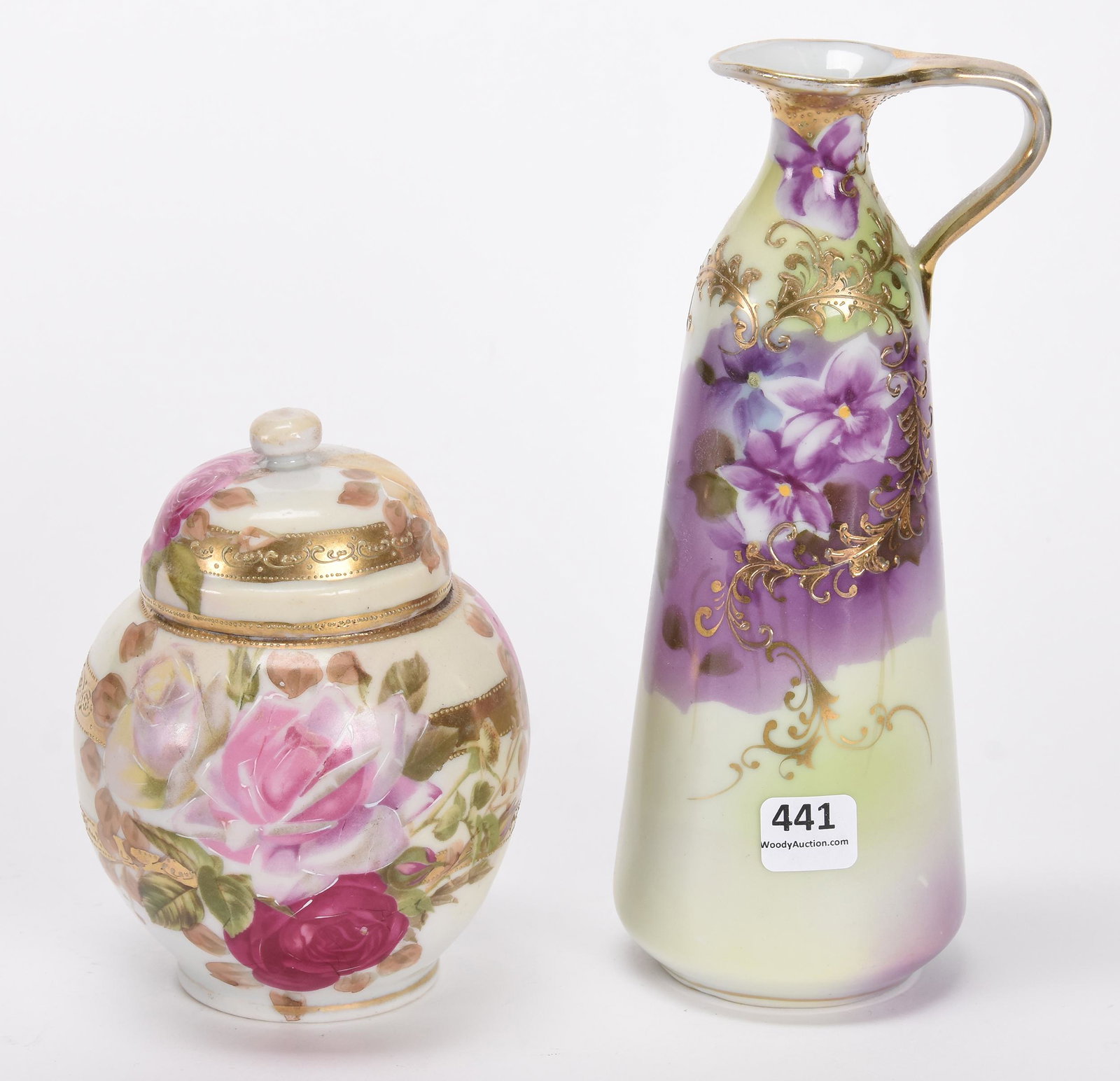 (2) Nippon style items: (2) Nippon style items; (1) 8.5" ewer marked Nippon, green & lavender tones with violet decor; (1) 5.5" covered jar marked SNB Nippon, cream tones with rose decor and gold trim; Callahan Collection, O