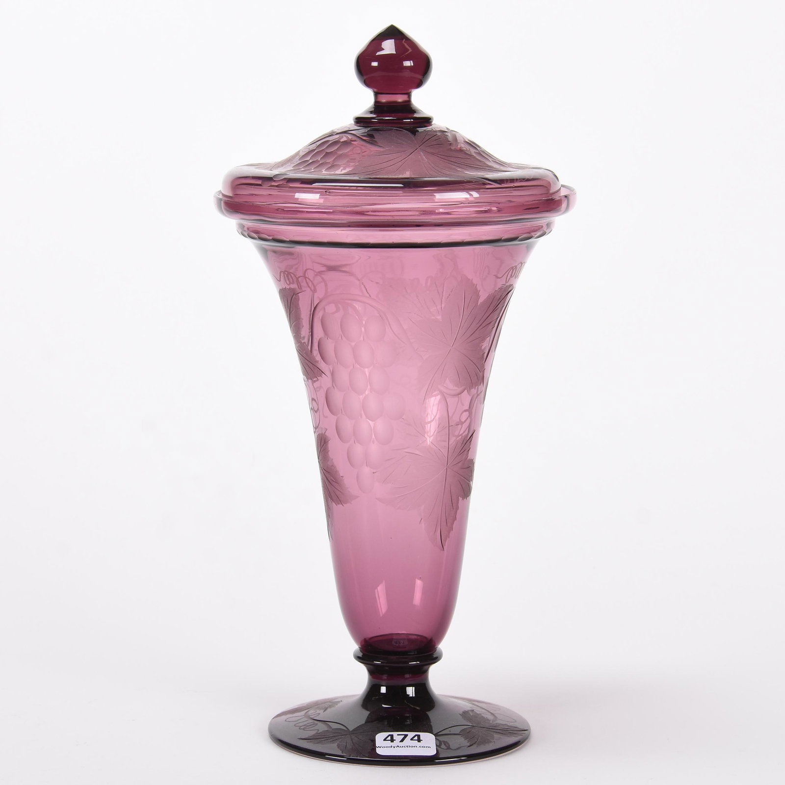 Covered urn by Pairpoint, solid amethyst: Covered urn by Pairpoint, solid amethyst; 10.75" Engraved vintage motif with pattern cut foot and matching lid ; Callahan Collection, Oklahoma