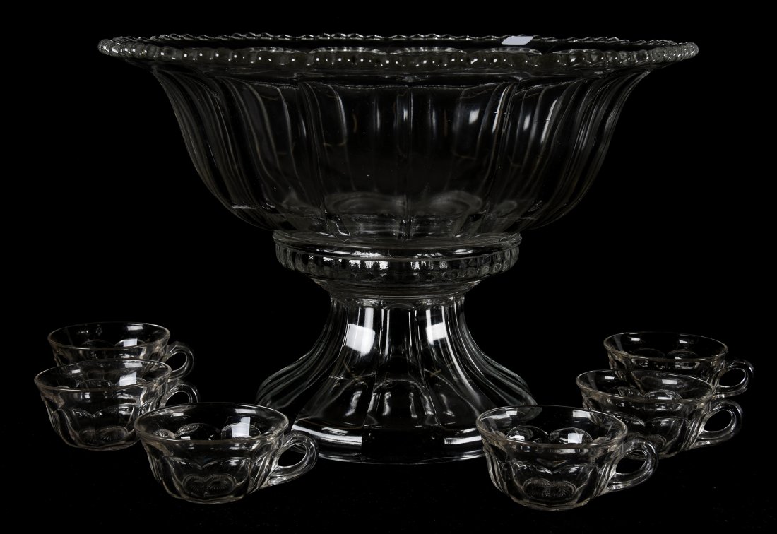 (8) Clear two part Punchbowl set by Indiana Glass: (8) Clear two-part Punchbowl set by Indiana Glass; 11" x 16", 2" Colonial pattern design #7115; (1) 11" x 16" Two part punchbowl and base; (6) matching 2" punch cups; Houghton Collection, Kansas