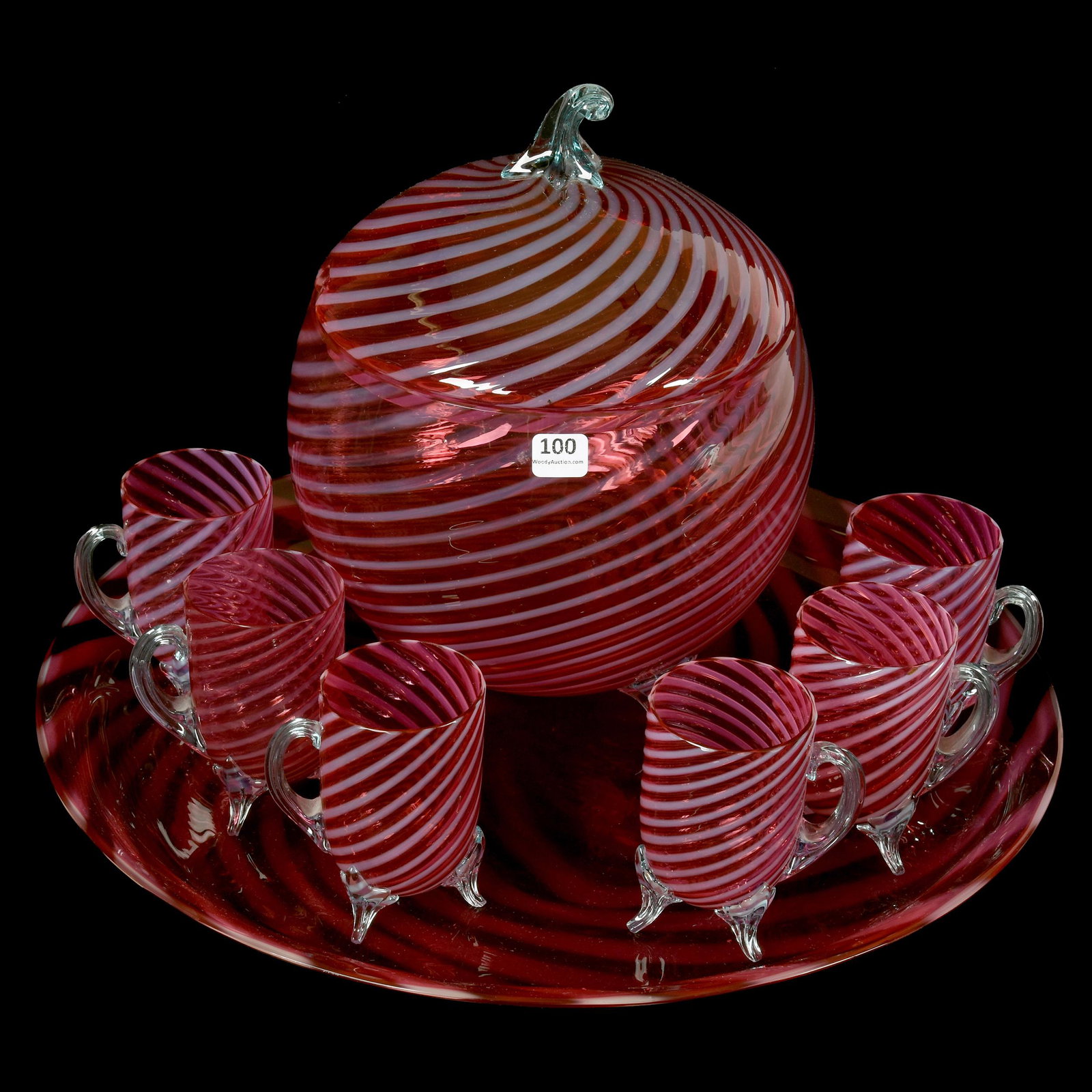 Punch Set, Cranberry Opalescent Swirl: Punch Set, Cranberry Opalescent Swirl; (1) 11.5" Footed Covered Punch Bowl with (6) Matching 4.25" Footed Punch Cups, All Set on 17.5" Diameter Matching Tray, Attributed to Stourbridge, Circa 1890, Ex