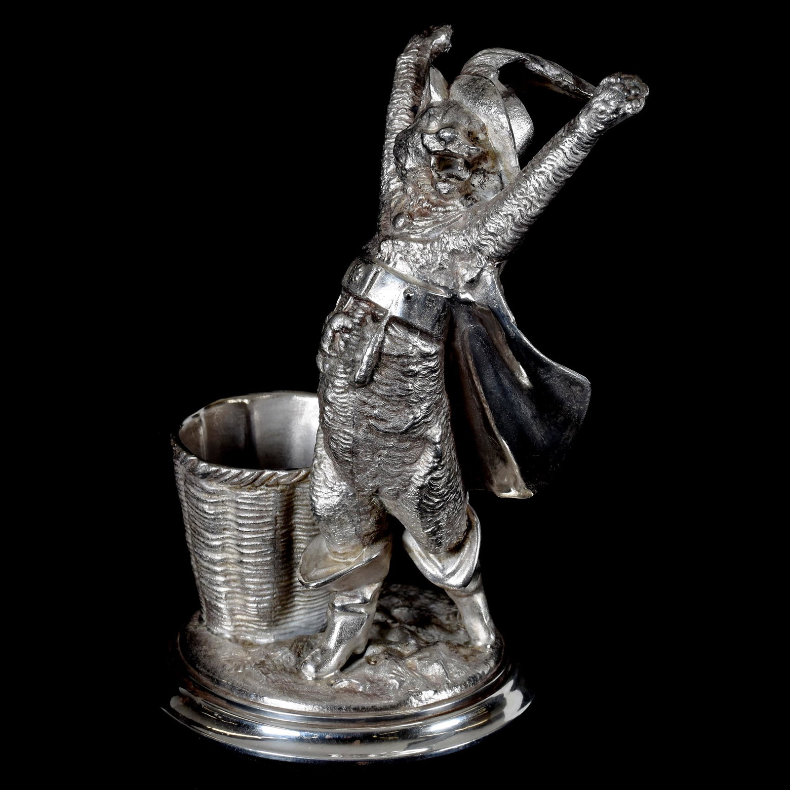 Victorian Silverplate Figural Cigar / Cigarette Holder: Victorian Silverplate Figural Cigar / Cigarette Holder; 7" Puss 'N Boots in Full Outfit, Standing Near Basket, Derby Silver Co., #2, Nice Quality; Private Collection.