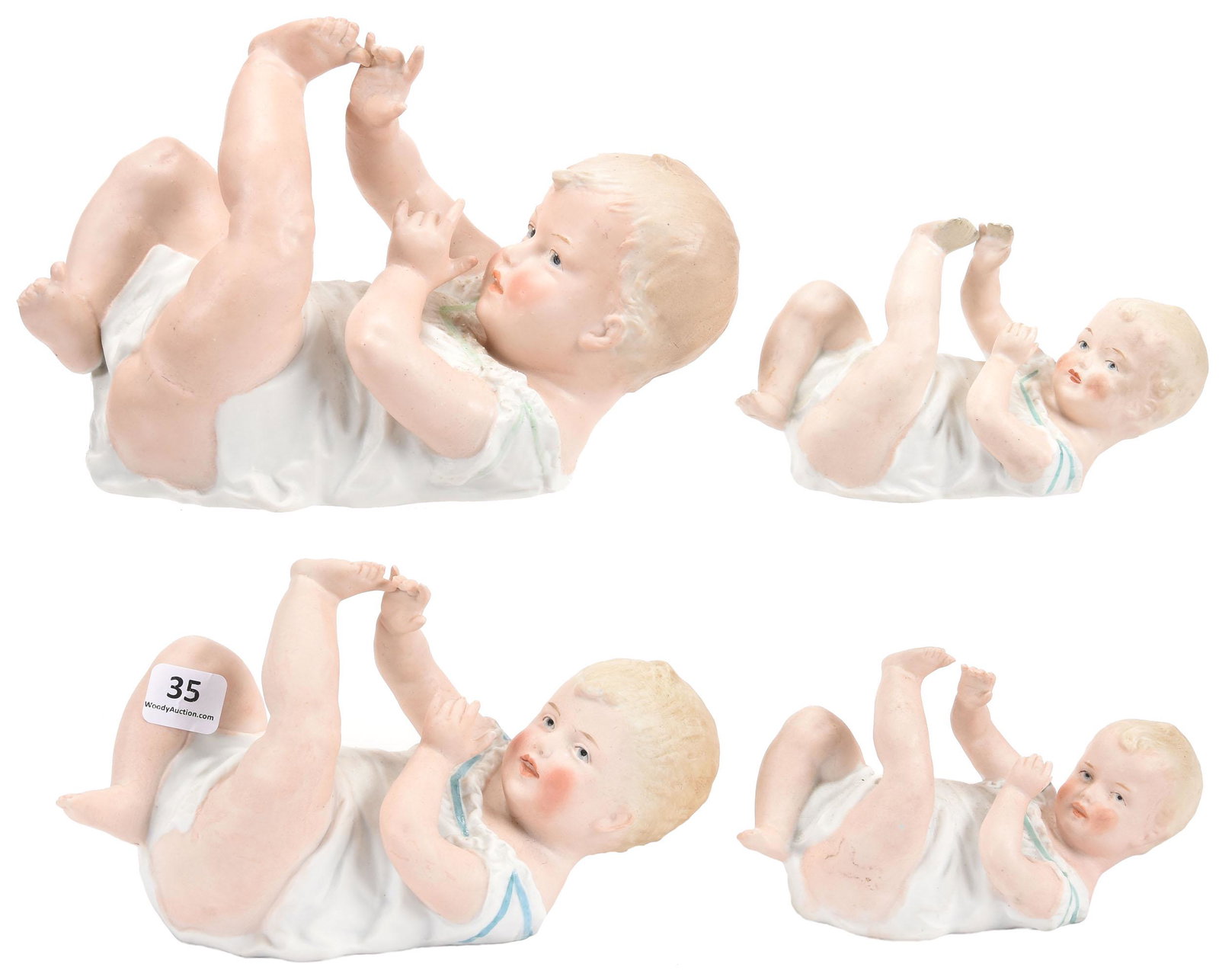 (4) Heubach Bisque Piano Babies, Marked: (4) Heubach Bisque Piano Babies, Marked; Lying on Back, Playing with Toes, (1) 8.5" (1) 7.5" (2) 5.5" One 5.5" Has Finger and Toe Repairs; Balliet Collection, Mississippi