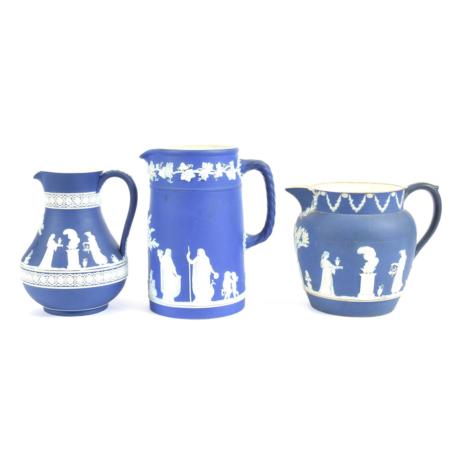 (3) Pitchers, Wedgwood Blue & White Classic Scenes: (3) Pitchers, Wedgwood Blue & White Classic Scenes, (1) 8", Marked M.I.E., (1) 7" Marked M.I.E., (1) 6.25" Marked England, Ron Duncan/Allen Goodwin