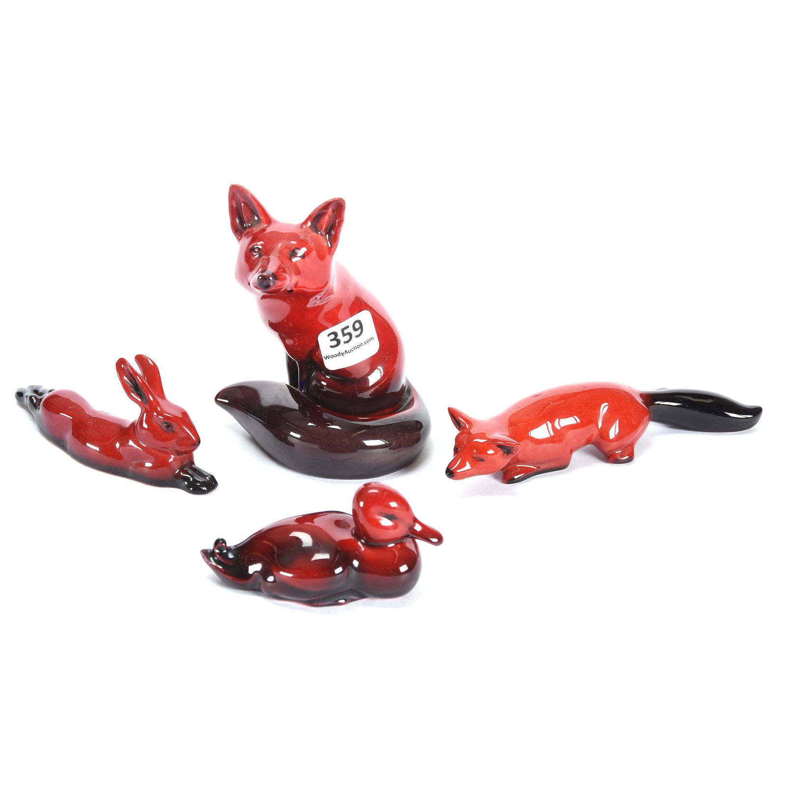 (4) Royal Doulton Flambe Figures: (4) Royal Doulton Flambe Figures, (1) 4.25" Sitting Fox, (1) 5" Crouching Fox, (1) 4" Rabbit Lying Down, (1) 3.25" Duck, from the estate of Ronald W. Prielipp PHD, Salina, KS. Ron was a professor of m
