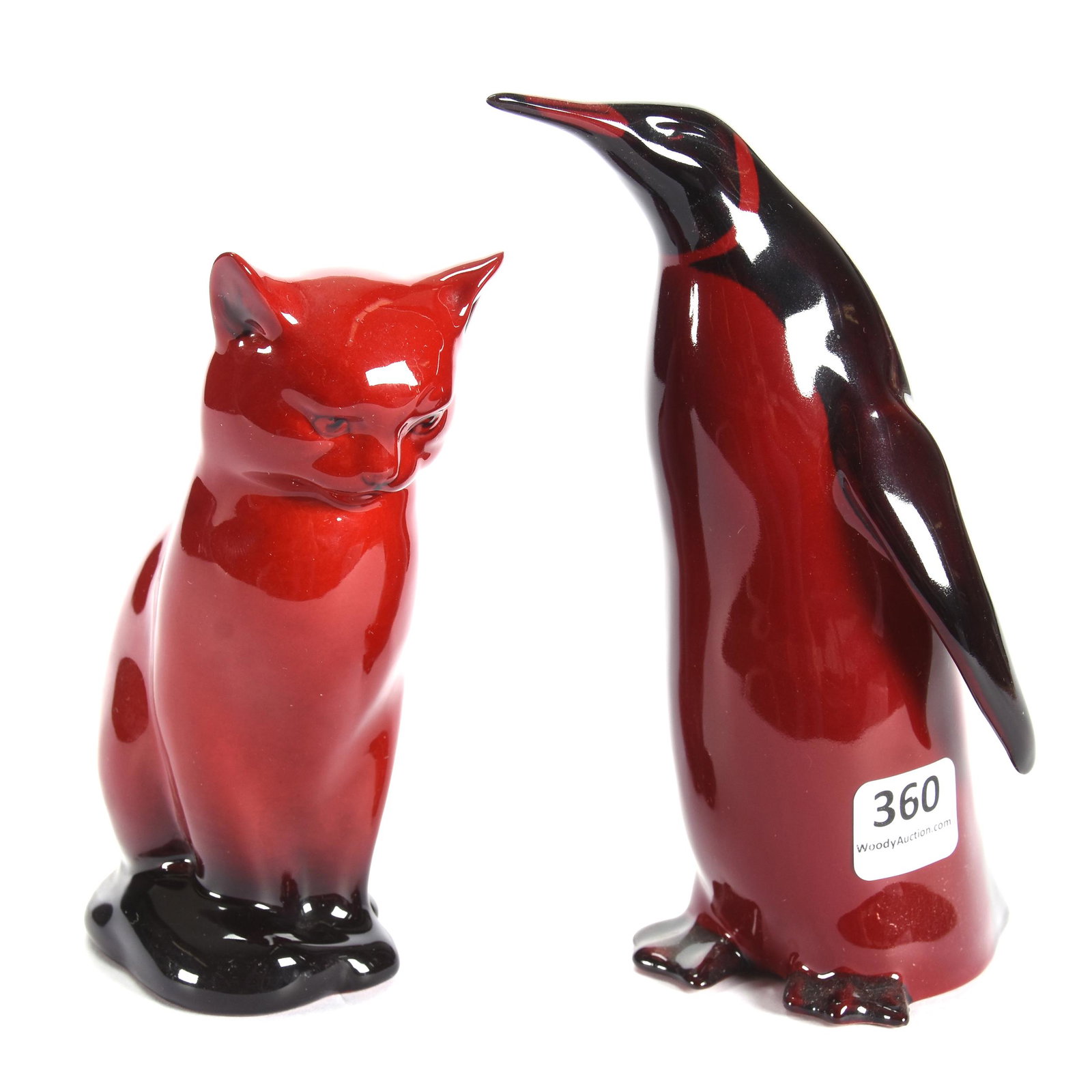 (2) Royal Doulton Flambe Figures: (2) Royal Doulton Flambe Figures, (1) 6" Penguin, (1) 5" Cat, Sitting, Cat has some Scratches on Side of Face, from the estate of Ronald W. Prielipp PHD, Salina, KS. Ron was a professor of mathematics