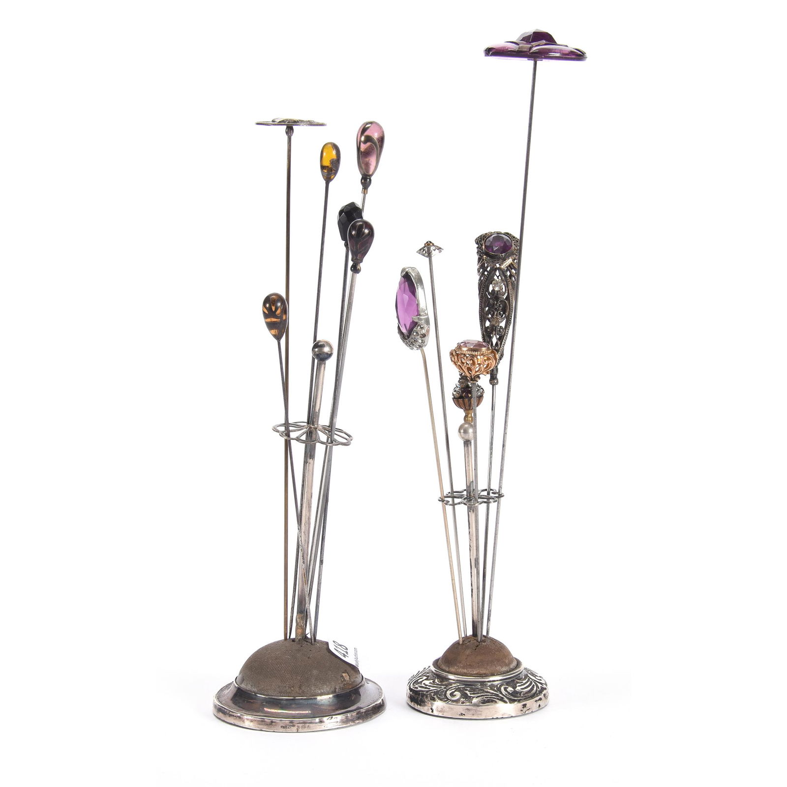 (12) Vintage Hatpins and (2) Holders: (12) Vintage Hatpins and (2) Holders, 5.5" & 4" Silver Base Hatpin Holders, (12) Vintage Hatpins Including One Hatpin Souvenir of 1904 St. Louis Exposition, Several Amethyst Pins, One has Loose Center