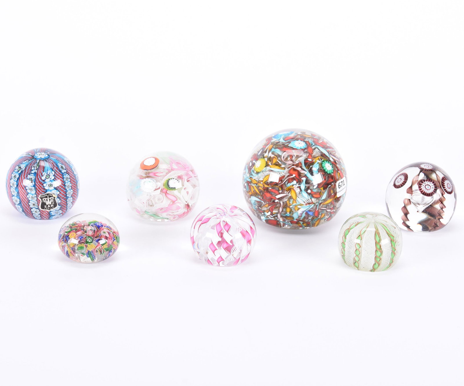 (7) Paperweights, Various Sizes 2.5" To 4.25" Dia.: (7) Paperweights, Various Sizes 2.5" to 4.25" Diameter, Scramble Cane and Ribbon Designs, One Weight with Bruise on Side, See Photos for Details, from the estate of Ronald W. Prielipp PHD, Salina, KS.