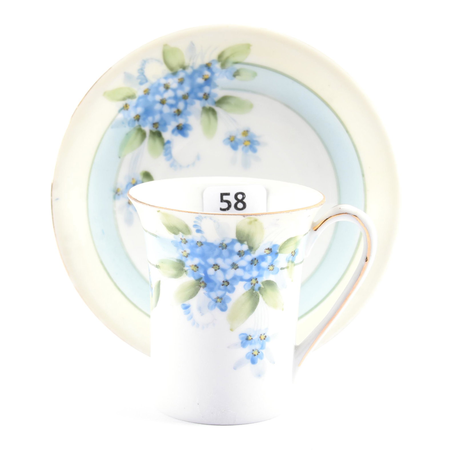 Cup & Saucer, Nippon Crown Mark: Cup & Saucer, Nippon Crown Mark, 3" x 4.75", White, Cream, and Blue with Blue Floral Decor, Eseline Reynolds Estate.