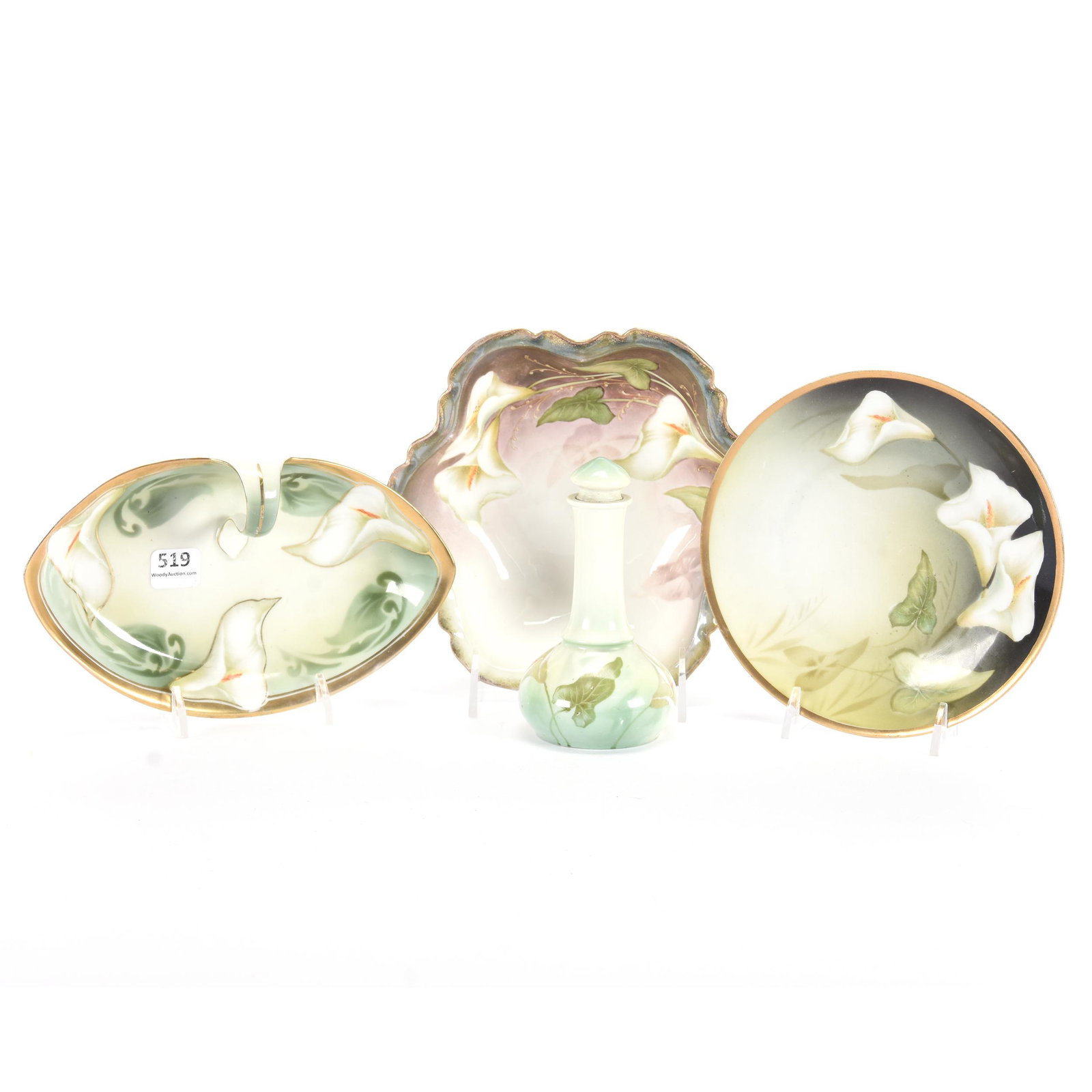 (4) R.S. Prussia/R.S. Germany Items, Easter Lily Decor: (4) R.S. Prussia/R.S. Germany Items, Easter Lily Decor, (1) 7" Bowl, Three Feet, Lustre Finish, R.S. Prussia, (1) 6.25" Plate Marked R.S. Prussia, (1) 7.5" Handled Nappy Marked R.S. Germany, (1) 4.75"