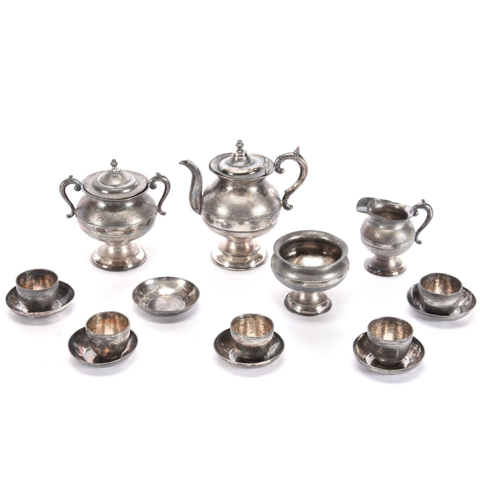 Child's Silver Tea Set In Original Box: Child's Silver Tea Set in Original Box, Teapot, Creamer, Sugar, Waste Bowl, (6) Saucers, (5) Cups, Note on Inside of Box Lid Dated August 4, 1886 States this Set is Present From Grandparents, Box in F