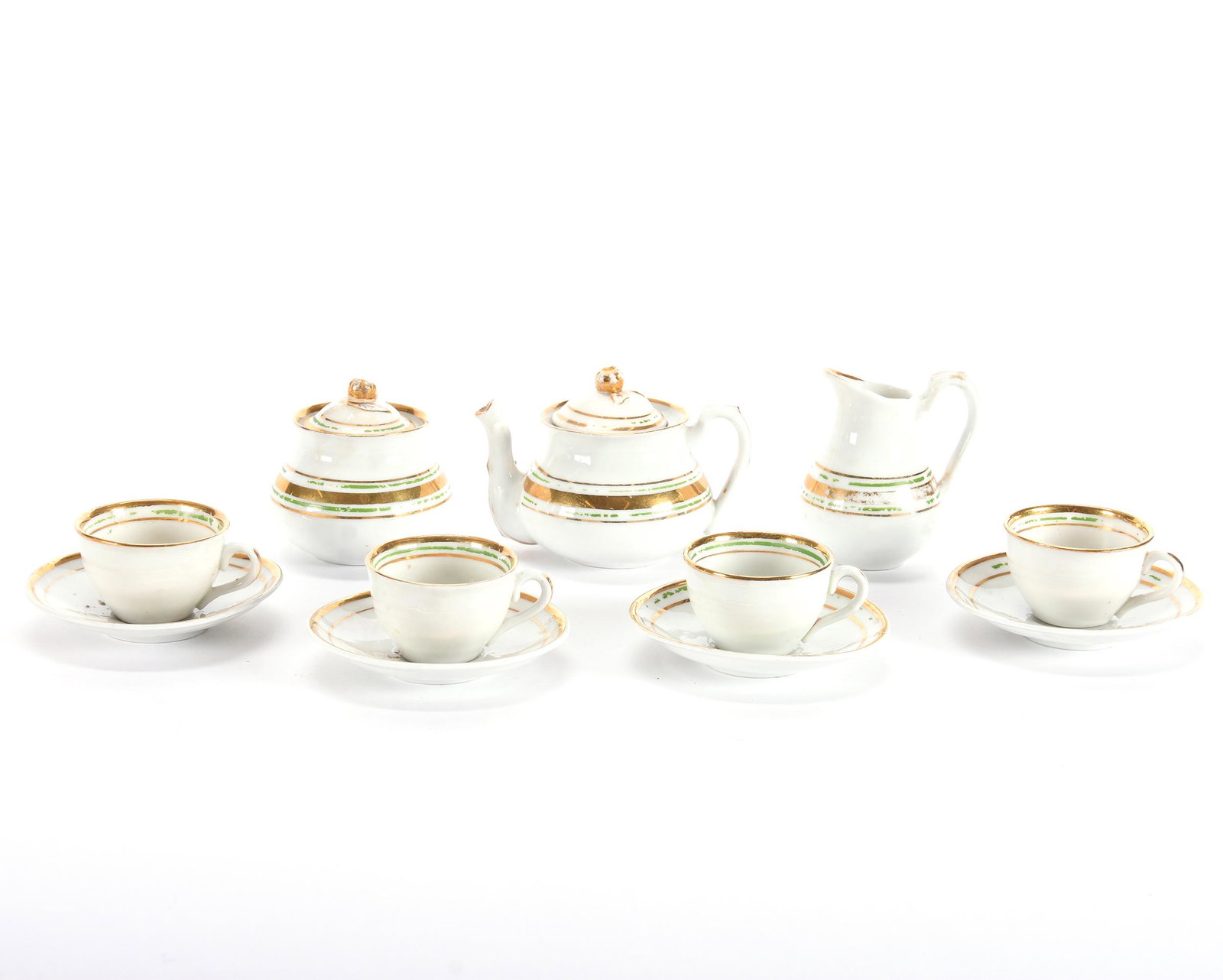 Child's Tea Set In Original Wooden Shipping Crate: Child's Tea Set in Original Wooden Shipping Crate, (7) Piece, White with Green and Gold Trim, 3" x 4" Teapot, Creamer, Sugar, (4) Cups & Saucers, Crate has Partial Original Label, Eseline Reynolds Est