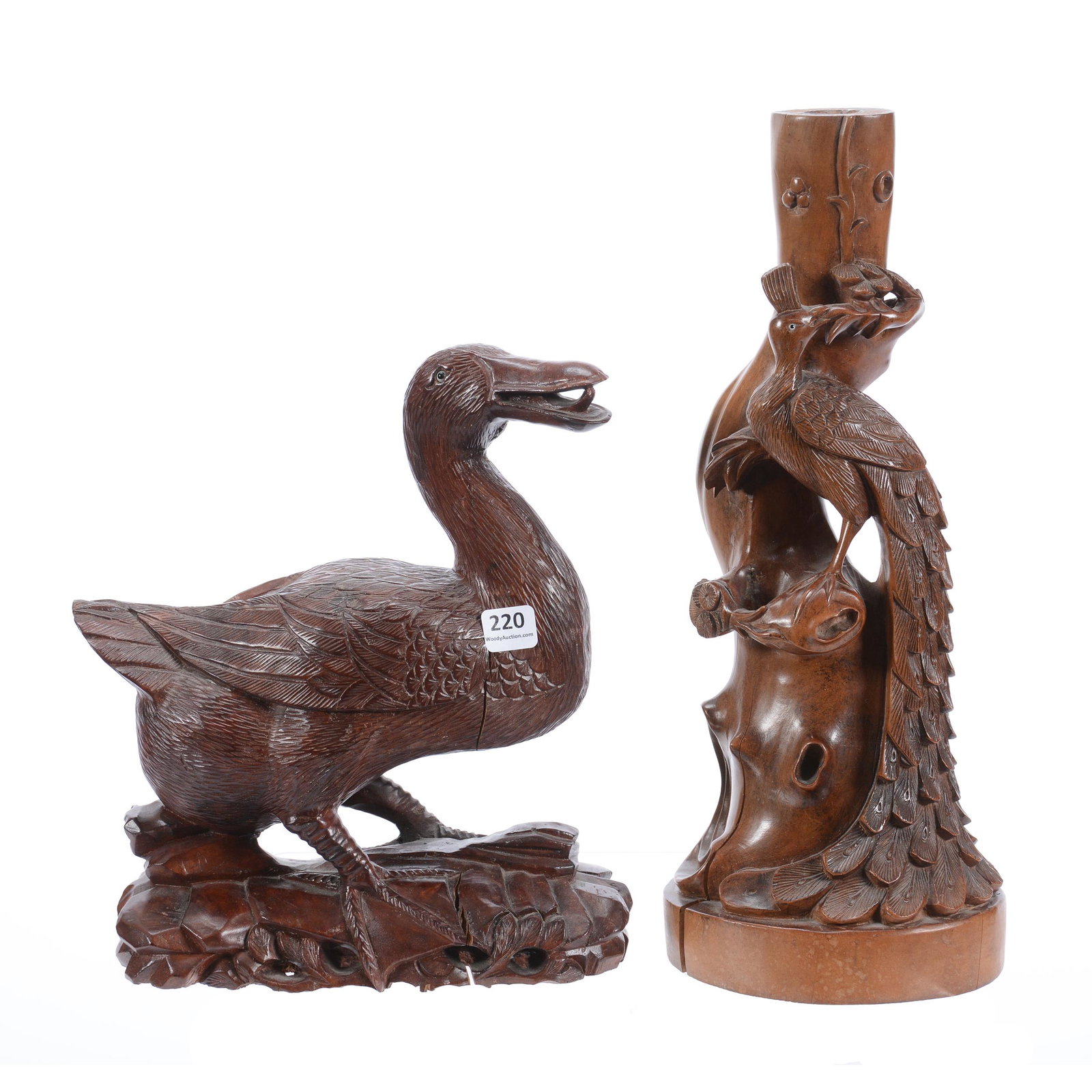 (2) Carved Wooden Figures: (2) Carved Wooden Figures, (1) 14" Solid One-Piece Carved Peacock and Tree Stump, One Natural Split in Wood, (1) 10.25" X 9", Solid One-Piece Carved Duck, Glass Eyes, One Natural Split in Wood, Privat