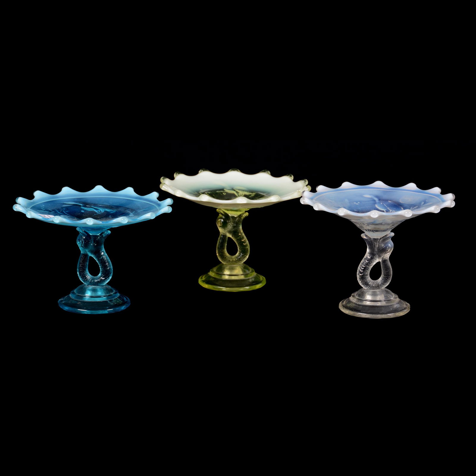 (3) Dolphin & Heron Compotes by Model Flint Glass: (3) Dolphin and Heron Compotes by Model Flint Glass, 4" X 5.25" Approx., (1) Vaseline Opalescent, (1) Blue Opalescent, (1) White Opalescent, Rare Group, Private Collection, KS