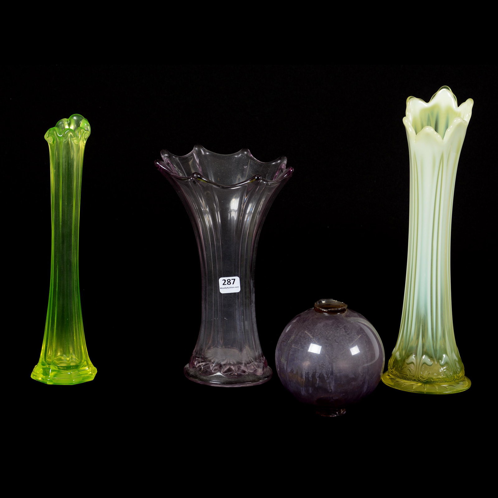 (4) Assorted Colored Pattern Glass Vases: (4) Assorted Colored Pattern Glass Vases, (1) 12.75" Vaseline Opalescent Iris with Meander Pattern, Two Base Chips, (1) 11" Vaseline Bud Vase, Eight-Sided, (1) 9.5" Amethyst Wide Rib, (1) 4.5" X 4.5" 