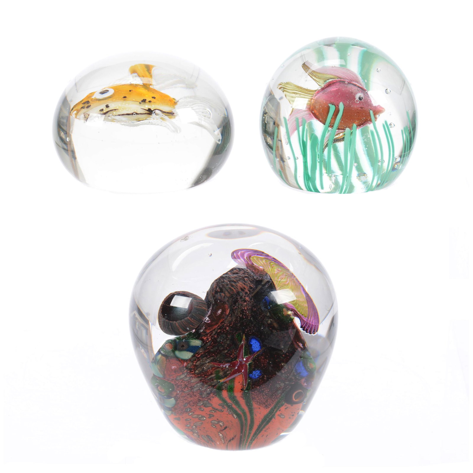(3) Paperweights, Underwater Scenes: (3) Paperweights, Underwater Scenes, (1) 4.25" Height and 4" Diameter, (1) 3.25" Diameter, Clear with Yellow Fish Design, Internal Flaw in Glass, (1) 3" Diameter, Clear with Seaweed and Pink Fish, Est