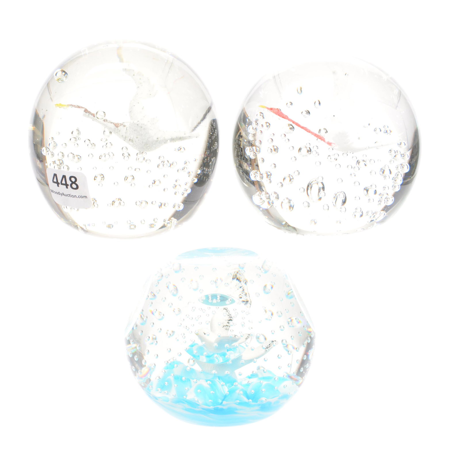 (3) Paperweights, Sulphide Bird In Flight Designs: (3) Paperweights, Sulphide Bird in Flight Designs, 3.25", (1) Clear Controlled Bubble Goose, (1) Clear Controlled Red Neck Goose, (1) Five Windows Cut, Sea Gull Flying Over Ocean Waves Signed Joe St. 
