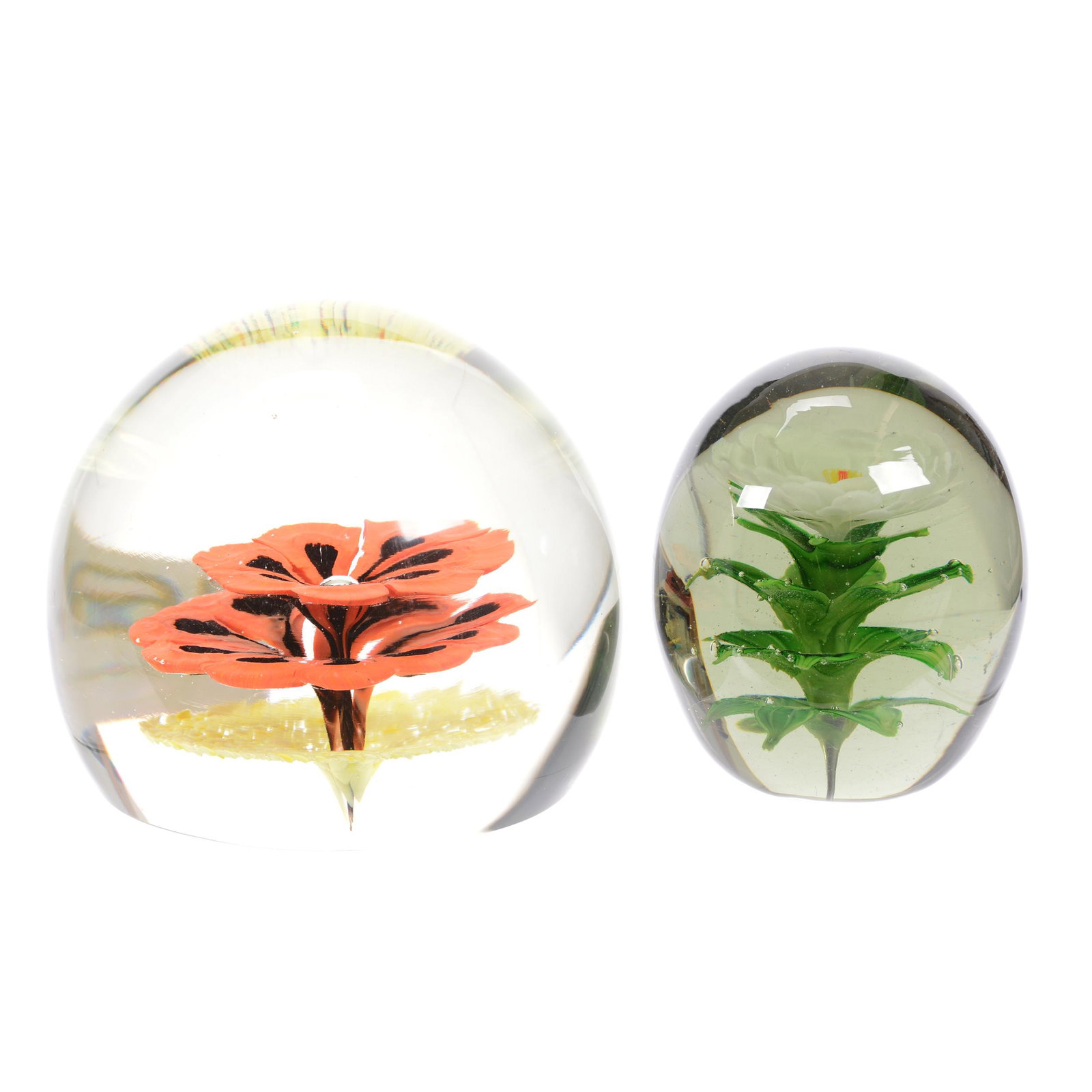 (2) Paperweights, Doorstop Size: (2) Paperweights, Doorstop Size, (1) 5.25" X 6" Height, Single Blossom with Orange, Black and Yellow Highlights, (1) 4.75" X 4" Height, Smokey Gray Blank with White Blossom and Green Leaf Design, Esta