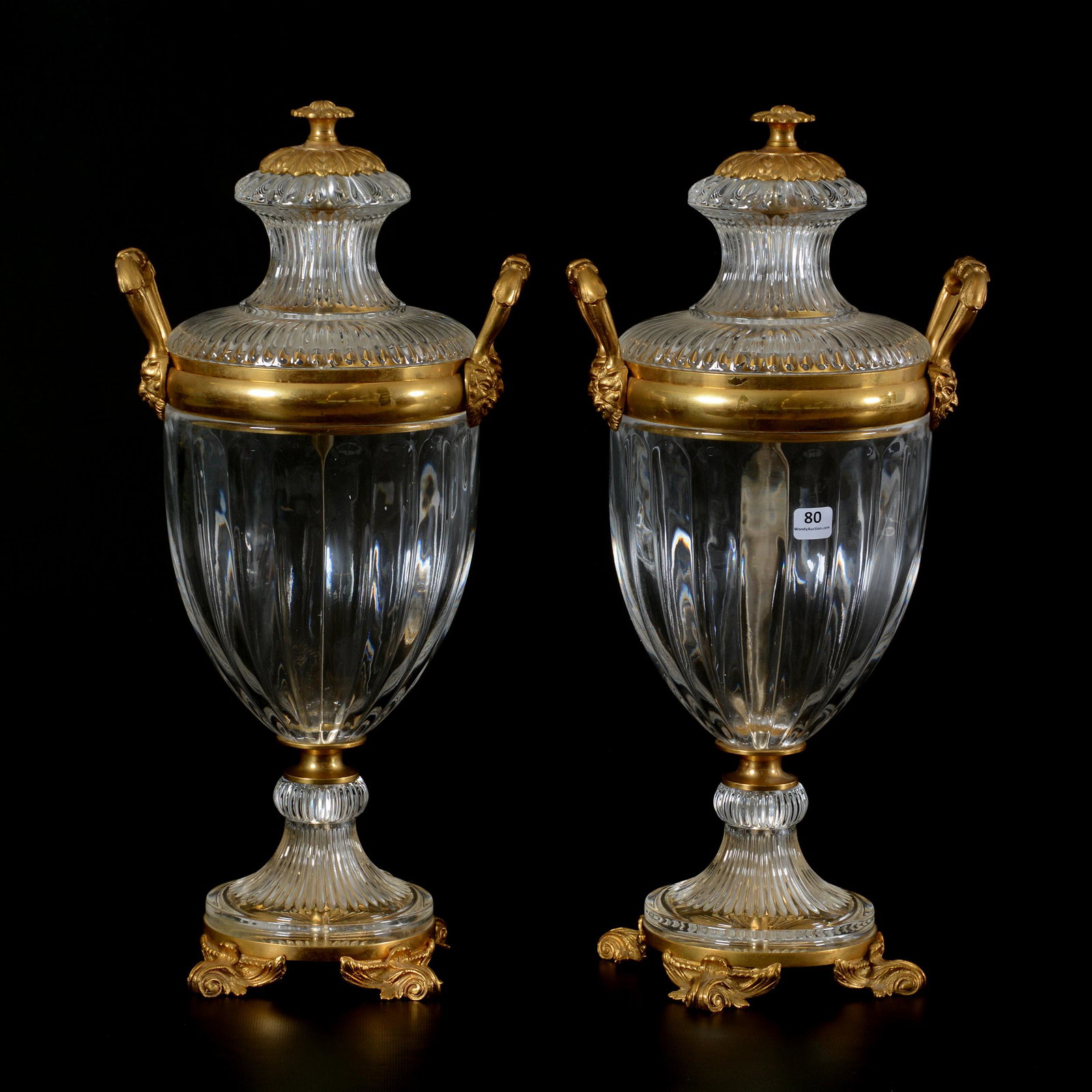 (2) Urns, Crystal/Gold Ormolu Attributed to Baccarat: (2) Urns, Crystal/Gold Ormolu Attributed to Baccarat, 19.5" X 9", Flawless Clear Crystal Bodies with Elaborated Gilt Ormolu Fittings, No Visible Maker's Marks, Fine Quality; the Collection of Mrs. R. 