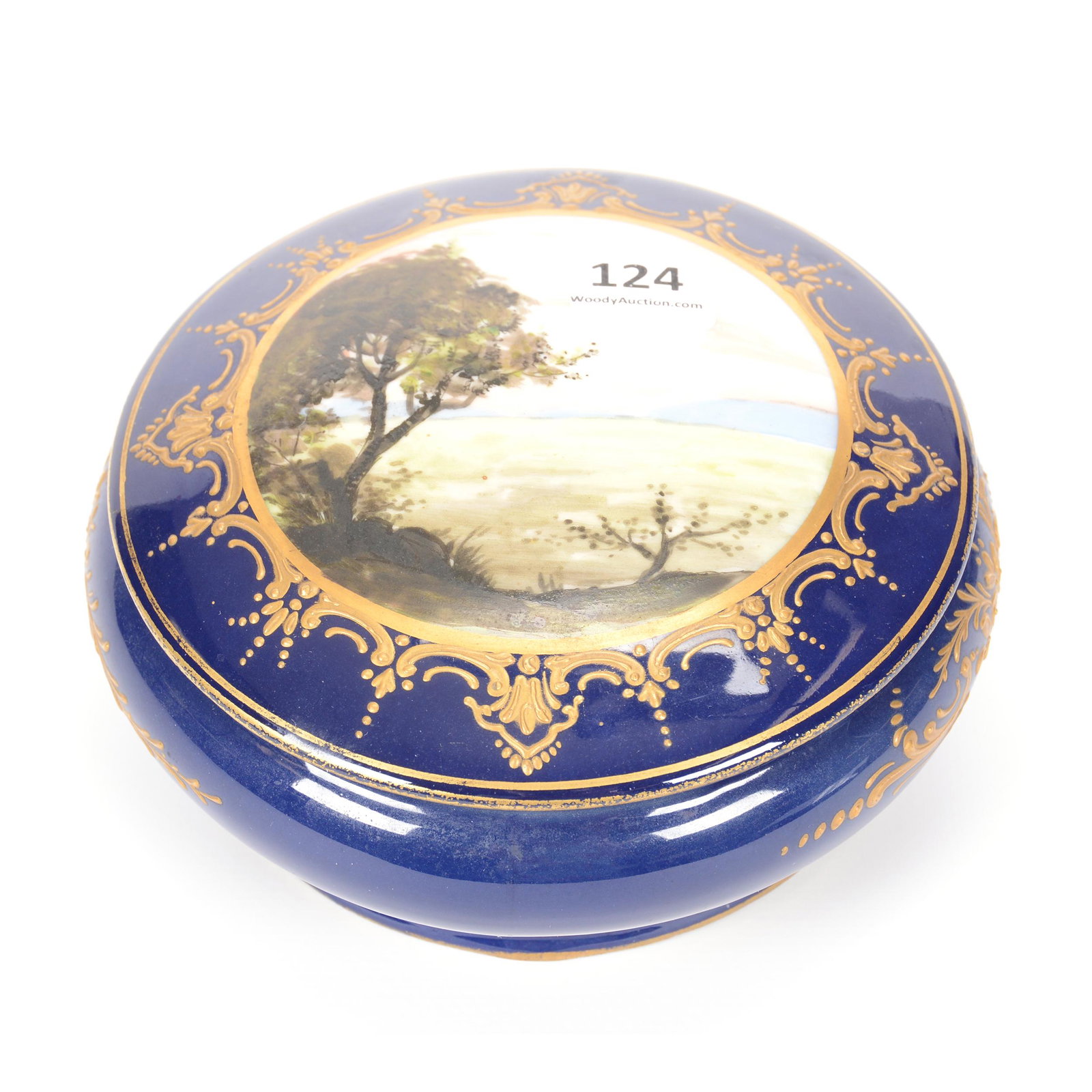 Covered Box Marked Sevres: Covered Box Marked Sevres, 3" X 5.5", Cobalt Blue with Scenic Field Decor, Gold Enamel Highlights; the Collection of Mrs. R. and the Late Dr. S. Alexander.
