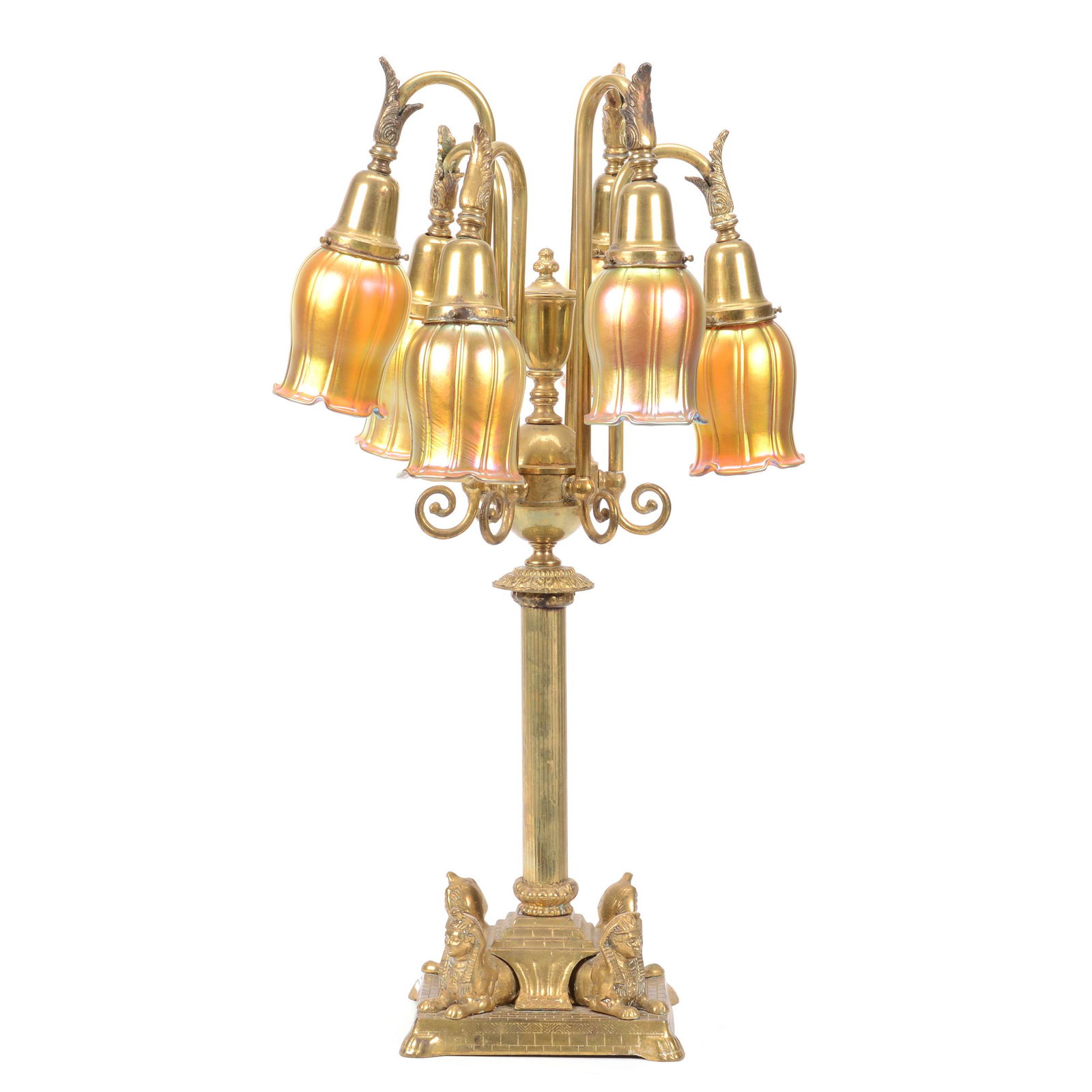Brass Six Arm Table Lamp with Art Glass Shades: Brass Six Arm Table Lamp with Art Glass Shades, 31", Egyptian Sphinx Design, Arms Hold (6) Bell Shaped Gold Iridescent Unmarked Shades Attributed to Steuben, One Shade has Chipping on Base Rim, One Li