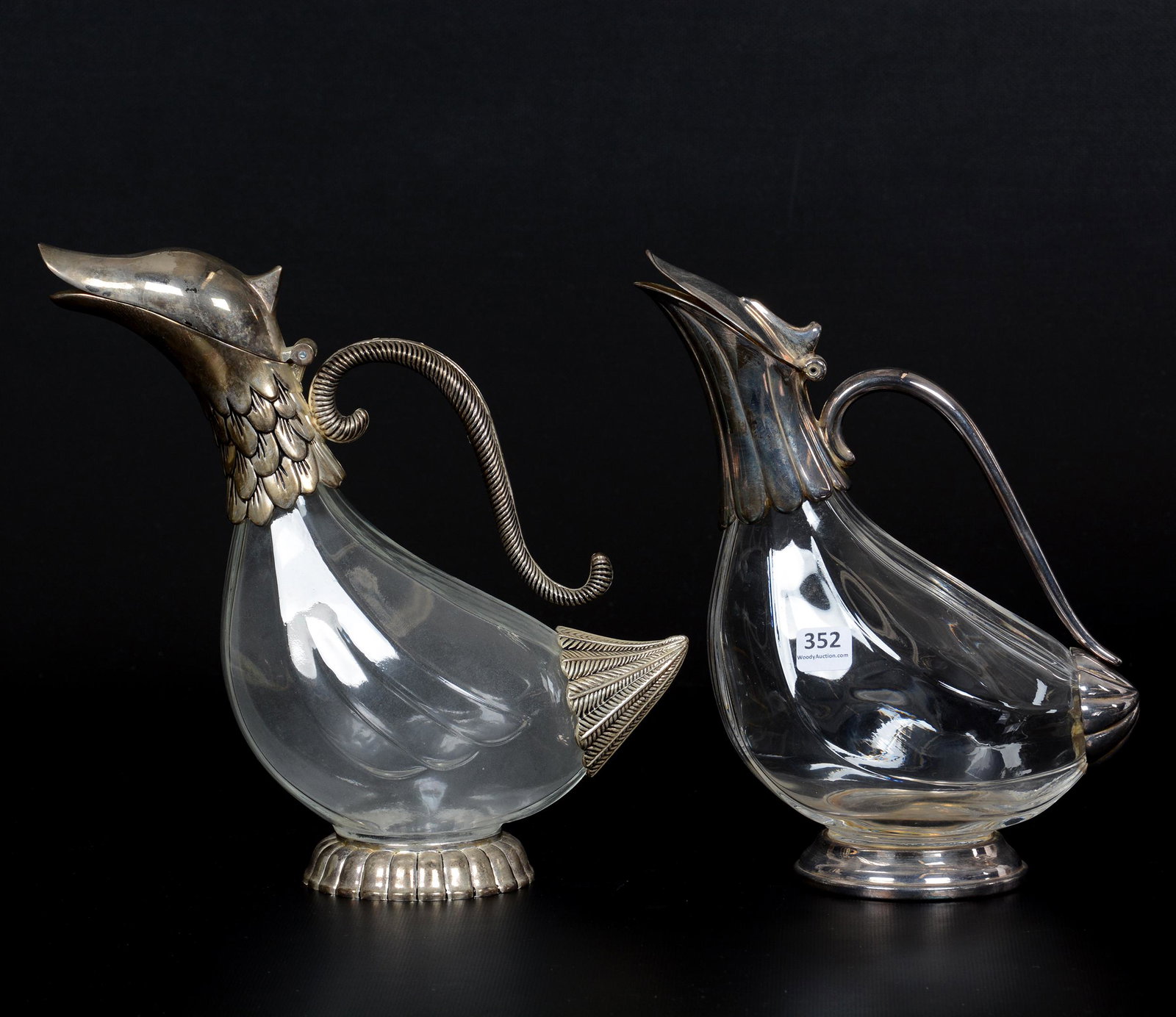 (2) "Duck" Form Handled Ewers, Silverplate Fittings: (2) "Duck" Form Handled Ewers, Silverplate Fittings, 10", Clear Glass Bodies; the Collection of Mrs. R. and the Late Dr. S. Alexander.