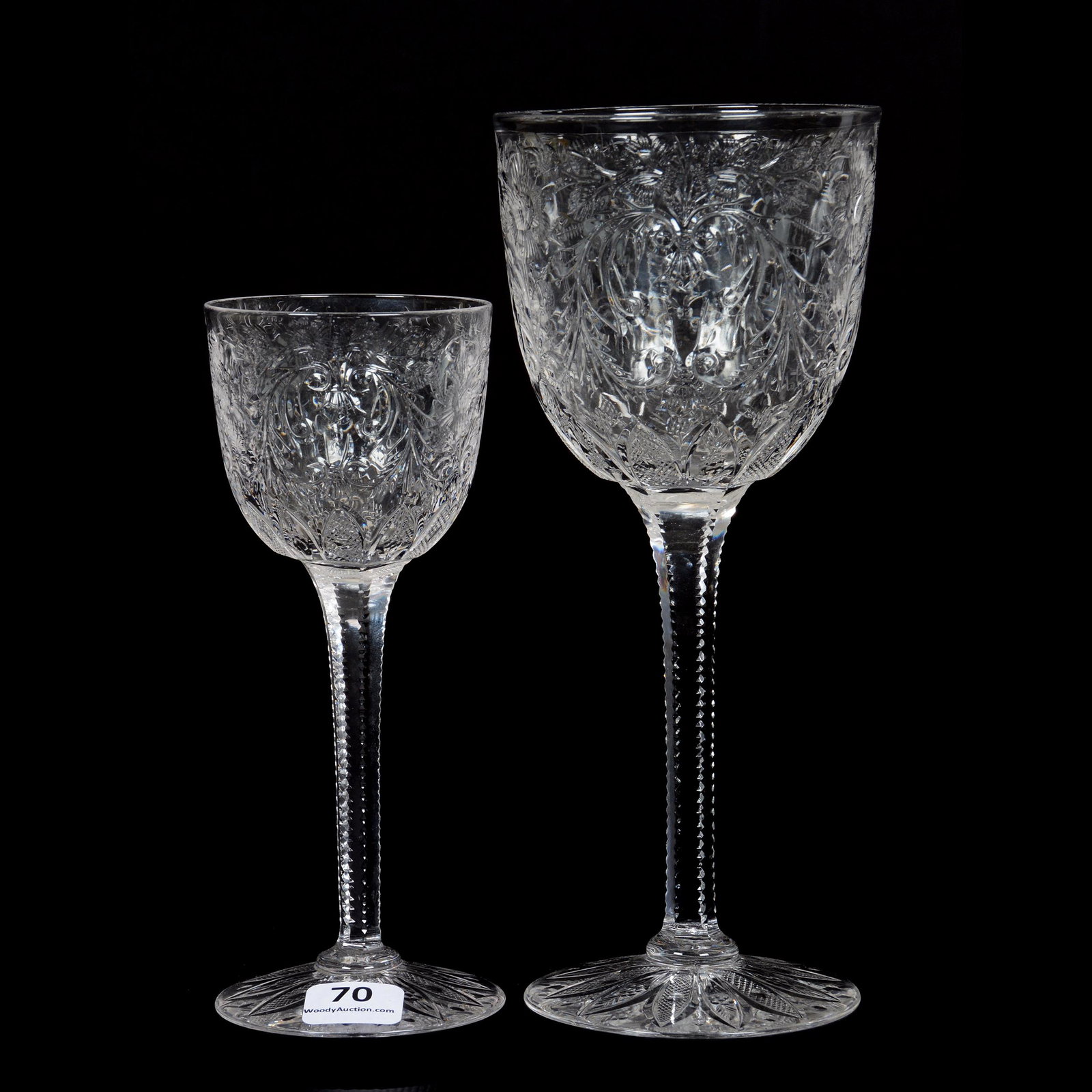 (2) Stems, Brilliant Period Cut Glass, Finely Engraved: (2) Stems, BPCG, Finely Engraved, Floral and Scroll Motif, Solid Notched Stem, Pattern Engraved Foot, (1) 8" Goblet, (1) 6.375" Wine, The William Buschling Collection