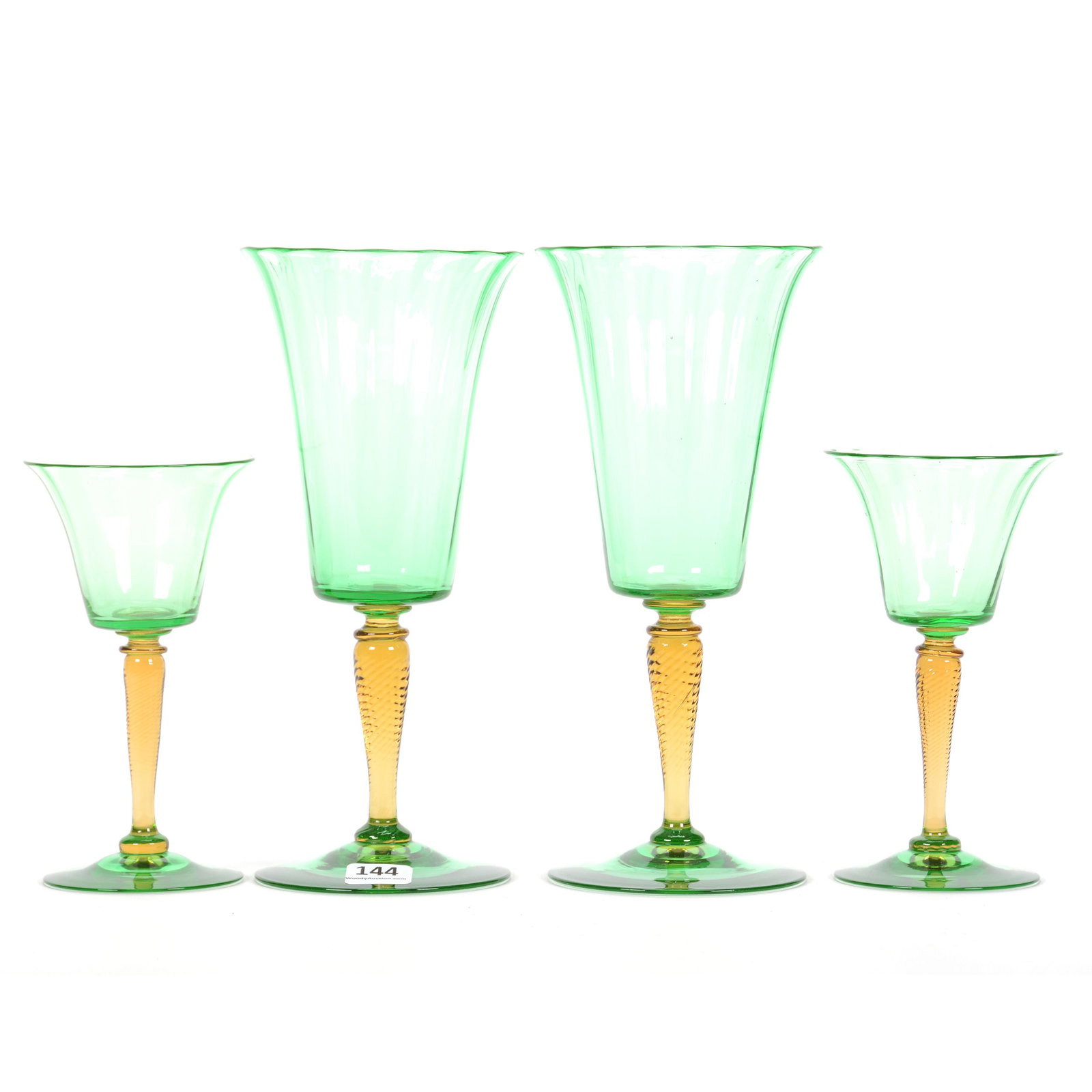 (4) Stems by Steuben, Shape #3551, Optic Rib: (4) Stems by Steuben, Shape #3551, Optic Rib, Pomona Green with Amber Spiral Stem, (2) 8.5" Goblets, (2) 7.75" Wines, The Estate of Les Hamilton