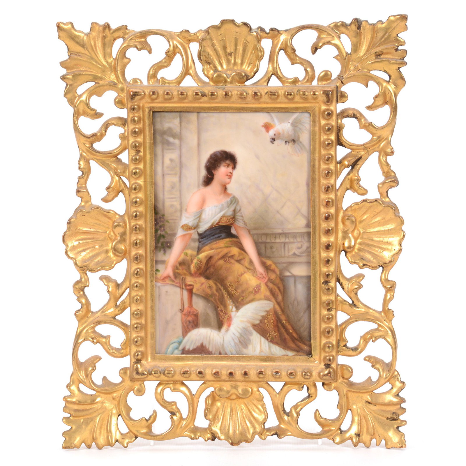 Porcelain Plaque Marked Germany, Hand Painted: Porcelain Plaque Marked Germany, Hand Painted, 6.25" x 4.25", Titled "Traumerei", Scene of Young Woman Seated with Two Cockatoos, Mounted in Elaborate 10.5" X 8.25" Gilt Wooden Frame, John Lolley Esta