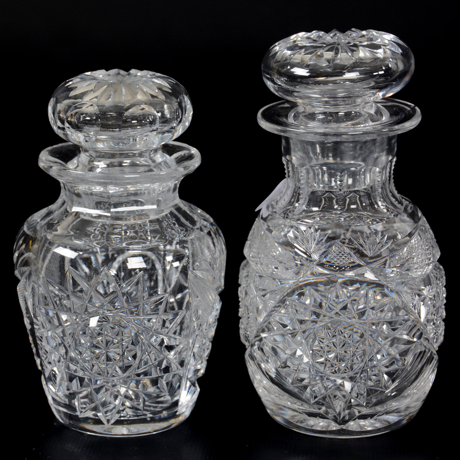(2) Covered Jars, American Brilliant Cut Glass: (2) Covered Jars, American Brilliant Cut Glass, (1) 5.5" X 3", Signed Libbey Colonna Pattern, Rim Chip, (1) 5" X 3", Hobstar, Strawberry Diamond And Fan Motif, Mike and Mary Ann Callahan Collection.