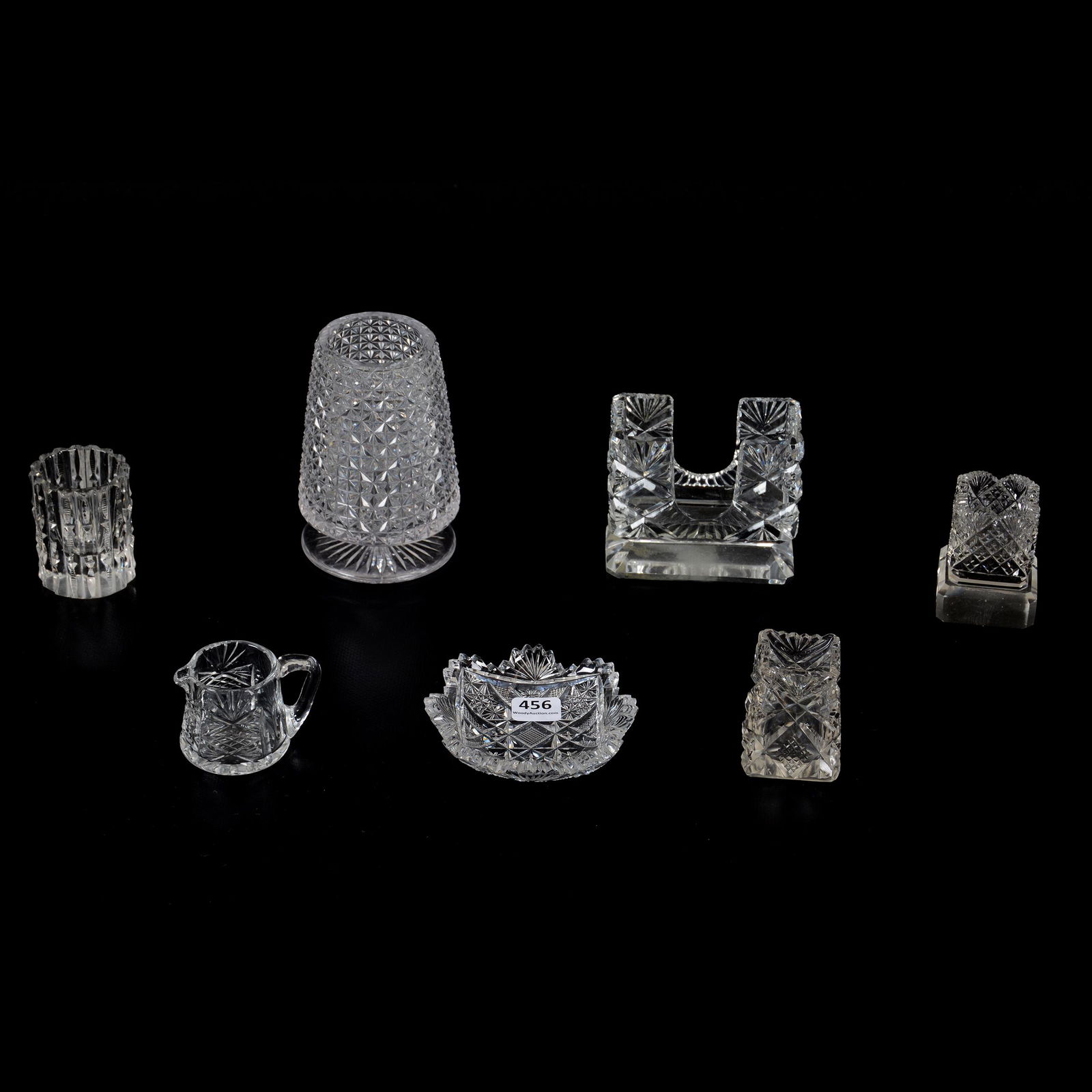 (7) Assorted Cut Glass Items: (7) Assorted Cut Glass Items, (1) 4.5" Pedestal Vase, Block Diamond, (1) 3" X 3.5" Playing Card Holder, Geometric Design, (1) 2.5" Toothpick Holder, Prism Pattern, (2) 2.5" Square Toothpick Holders, P