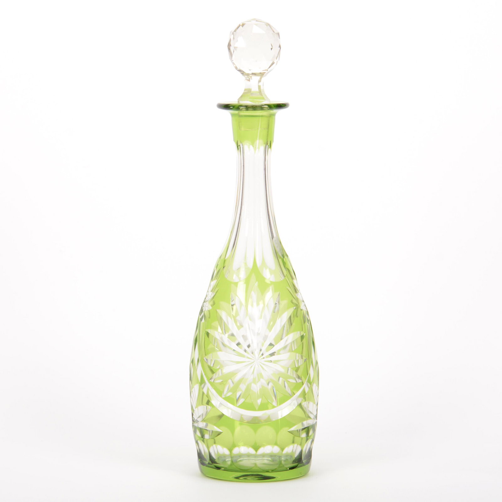 Decanter, Cut Glass, Green Cut To Clear: Decanter, Cut Glass, Green Cut To Clear, 14" x 4", Star, Fan And Bullseye Motif, Polished Pontil Base, Stopper Is Not A Good Fit, Chips On Stopper Plug, Mike and Mary Ann Callahan Collection.