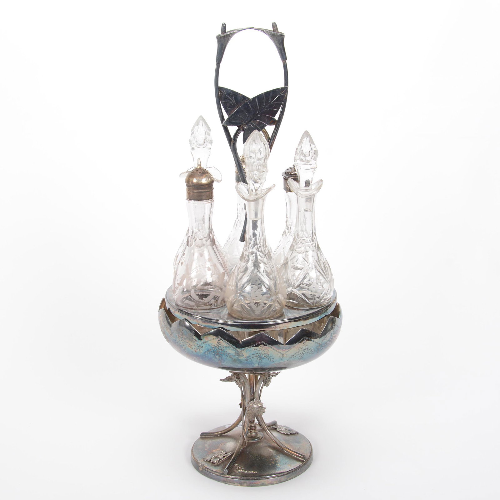 Victorian Castor Set With Six Clear Bottles: Victorian Castor Set With Six Clear Bottles, 18" x 7", Etched Floral Design On Bottles, One Bottle Has Hard To See Rim Chip, Set On Meriden #22 Silverplate Stand With Lily And Vintage Design, Private 