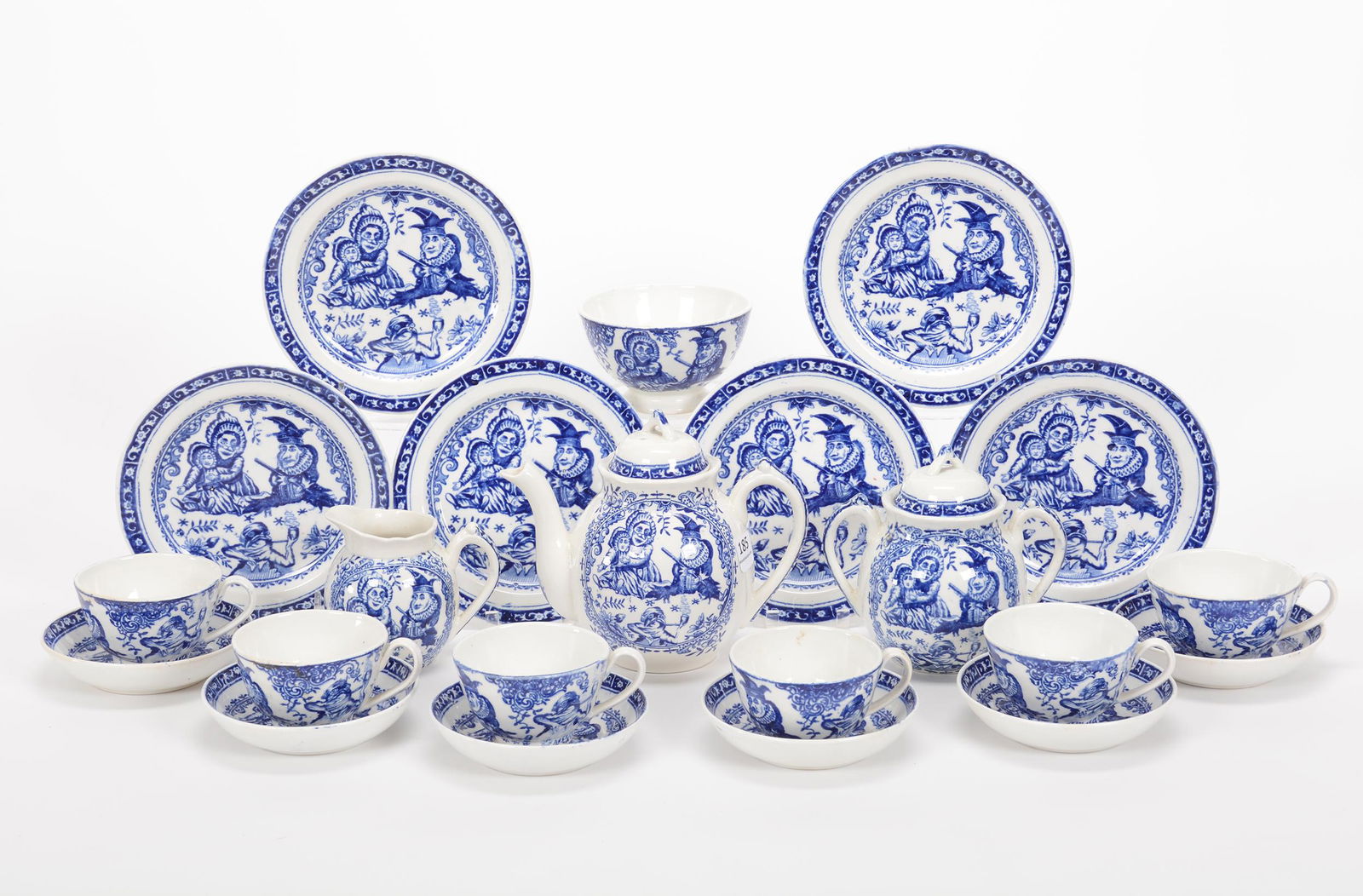 (16) Piece Child's Tea Set, Punch And Judy Decor: (16) Piece Child's Tea Set, Punch And Judy Decor, Blue And White, (1) 5.25" x 6.25" Teapot, Creamer & Covered Sugar, (6) Cups & Saucers, (6) 5.75" Dessert Plates, (1) 3.75" Waste Bowl, Private Estate