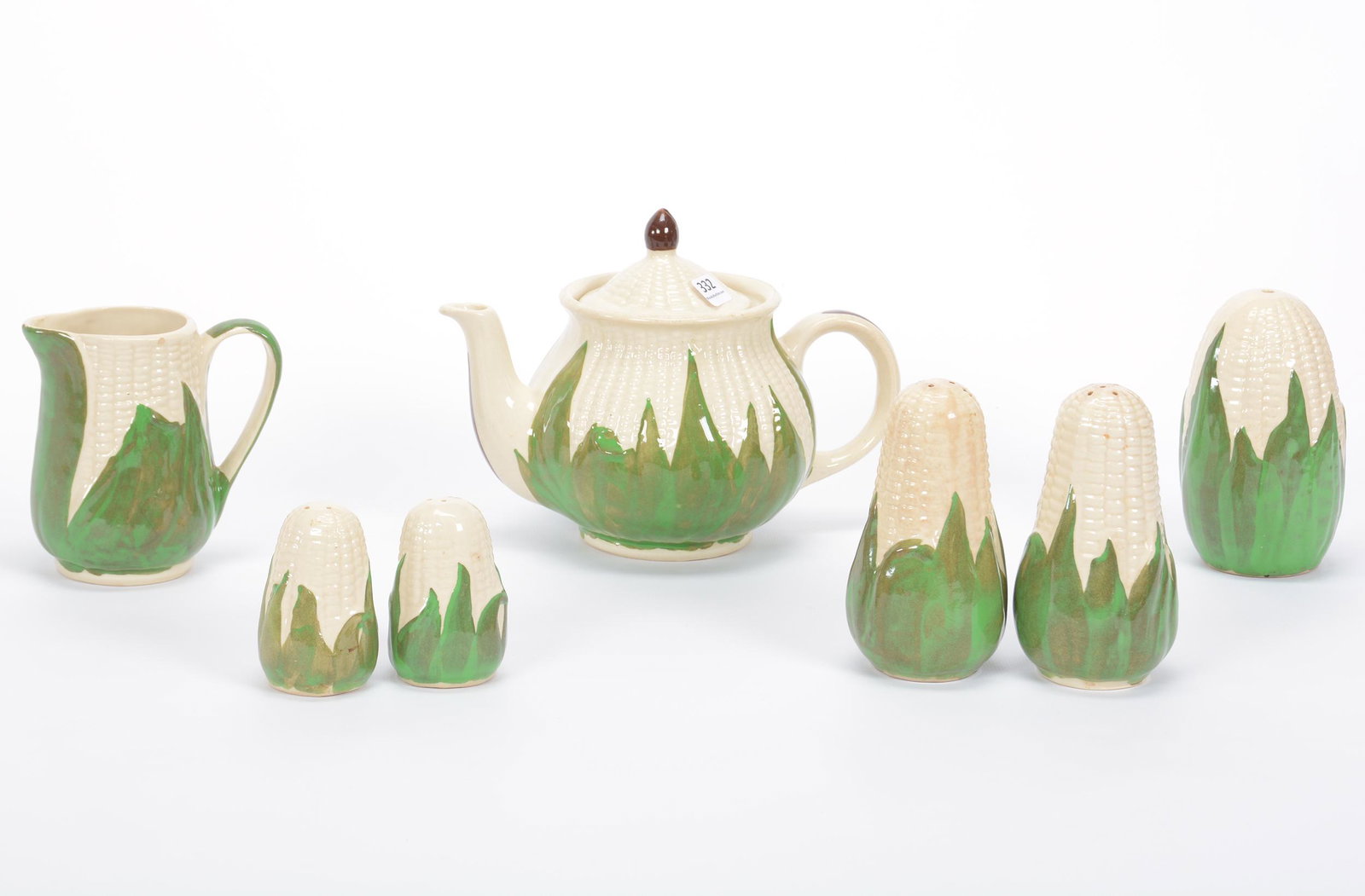 (7) Assorted Items, Shawnee Pottery Corn Queen: (7) Assorted Items, Shawnee Pottery Corn Queen, (1) 6.5" x 9" Teapot, (1) 5.25" Sugar Shaker, (1) 5.25" Salt/Pepper, (1) 4.75" Creamer With Glaze Nick On Rim, (1) 3.25" Salt/Pepper, Private Estate Col