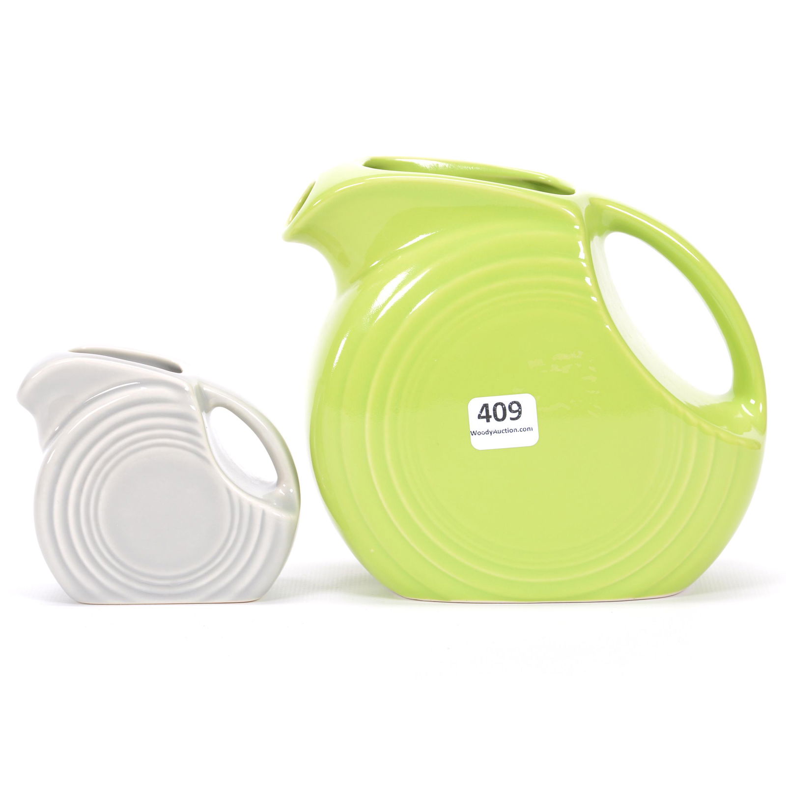 (2) Post-1986 Fiestaware Pottery Disc Pitchers: (2) Post-1986 Fiestaware Pottery Disc Pitchers, (1) 6", Chartreuse, (1) 3.25", Gray, Private Collection, KS
