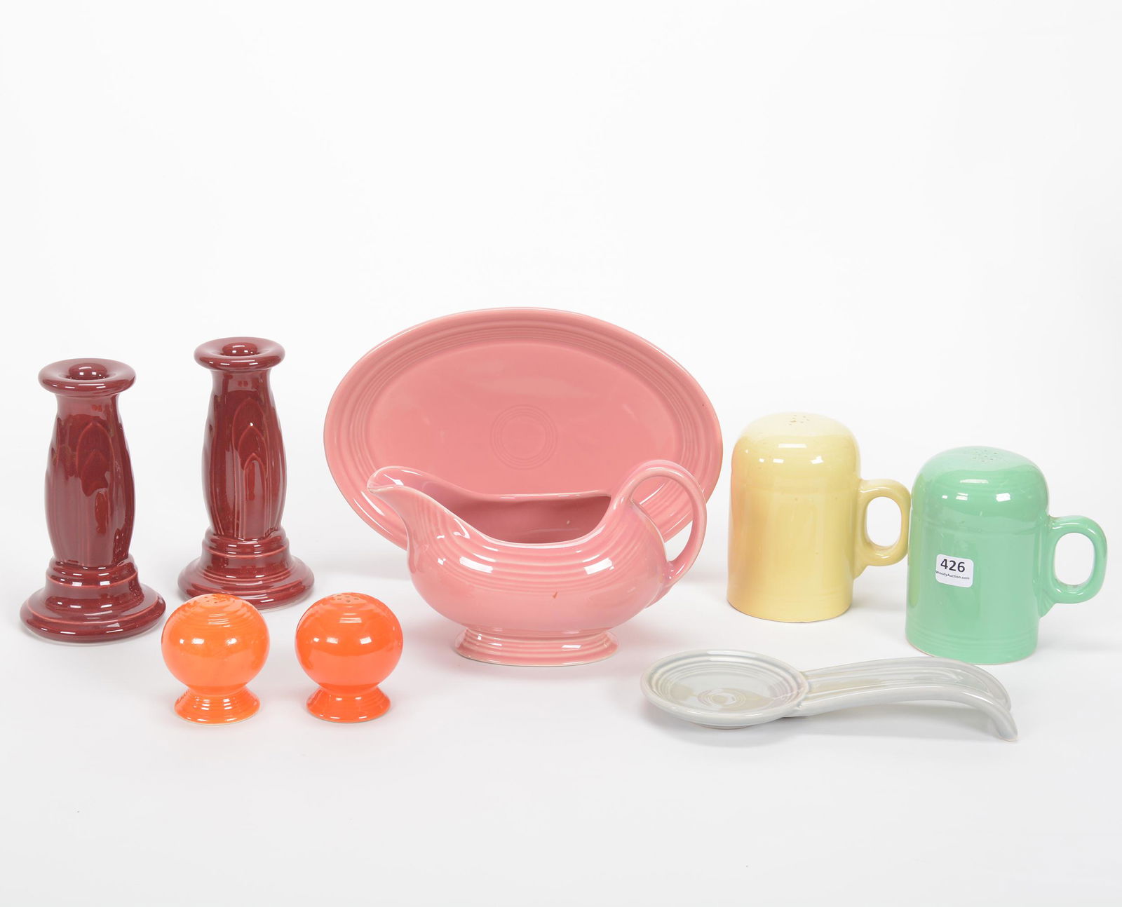 (9) Post-1986 Fiestaware Items: (9) Post-1986 Fiestaware Items, (1) 6.25" Pair Candlesticks, (1) 4.5" Salt & Pepper Set, (1) 2.5" Salt & Pepper Set, (1) 8" Spoon Rest, (1) 5" x 9.75" Gravy Boat With Underplate, Private Collection, K