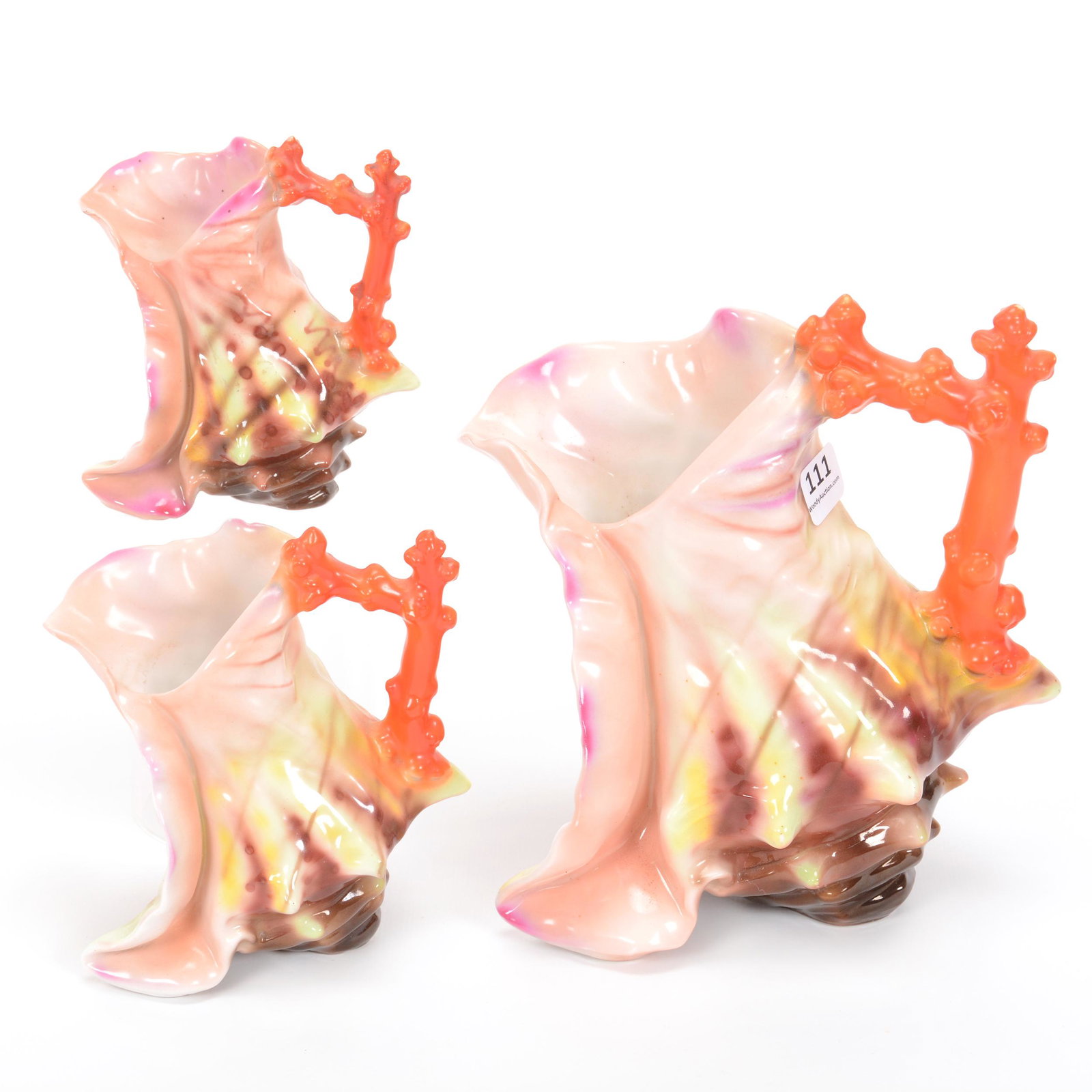 (3) Royal Bayreuth Items, Spiky Shell With Coral Handle: (3) Royal Bayreuth Items, Spiky Shell With Coral Handle, Unmarked, Boot Shape, (1) 7.75" Water Pitcher, (1) 5.25" Milk Pitcher, (1) 4.5" Creamer, Private Midwest Collection