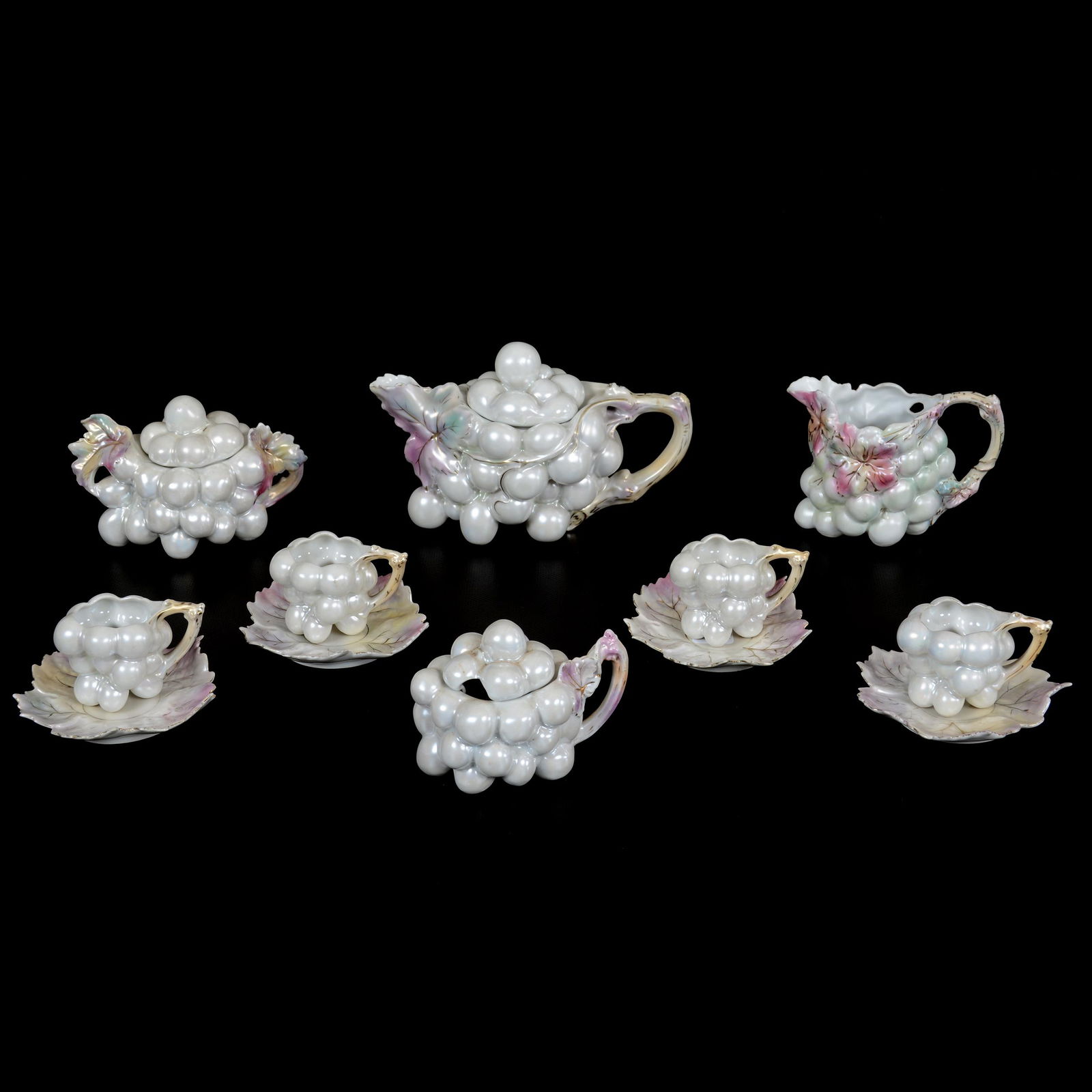(8) Unmarked Royal Bayreuth White Satin Grape Items: (8) Unmarked Royal Bayreuth White Satin Grape Items, (1) 4.75" X 7.5" Tea Pot, (1) 3.75" Creamer & Covered Sugar Set, (1) 3.25" Mustard Jar, (4) 2.5" X 4.25" Cups And Sauers, Private Midwest Collectio