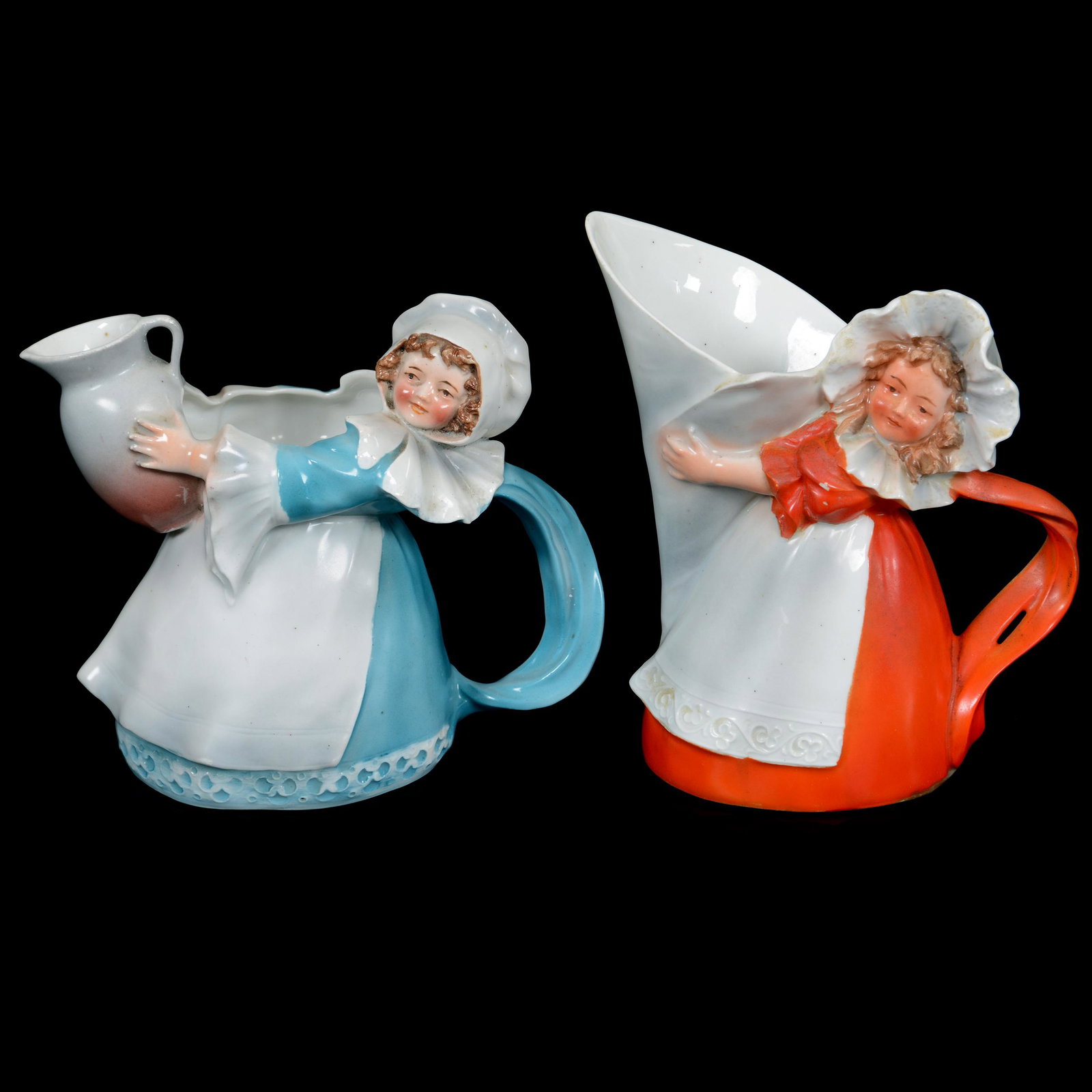 (2) Milk Pitchers Marked Royal Bayreuth Milk Maid: (2) Milk Pitchers Marked Royal Bayreuth Milk Maid, Blue Mark, (1) 5.75" Red Dress Holding Funnel, (1) 4.75" Blue Dress Holding Jug, Private Midwest Collection