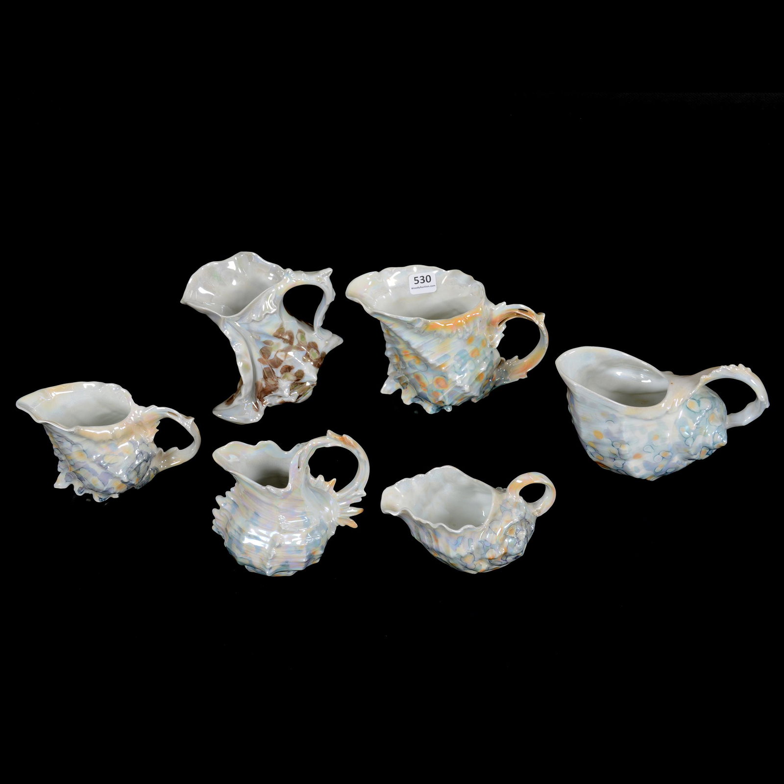 (6) Pitchers Royal Bayreuth Shell: (6) Pitchers Royal Bayreuth Shell, (1) 5" Boot Shape Milk Pitcher, Bavaria Mark, (1) 4.5" Blue Mark Milk Pitcher, (1) 4" Milk Pitcher, Green Mark, (1) 4.5" Spiky Shell Creamer, Blue Mark, (1) 3.5" Cre