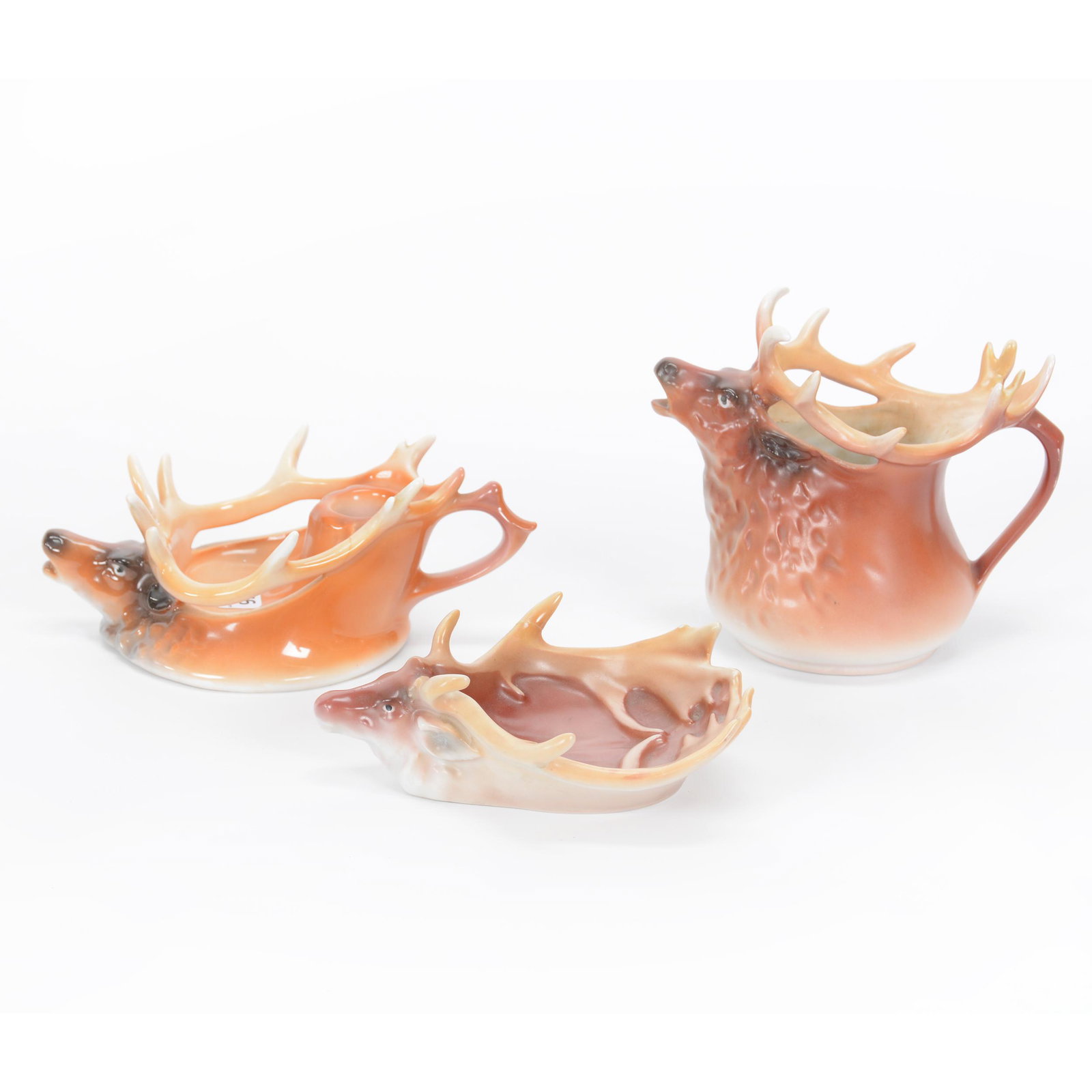 (3) Damaged Or Repaired Royal Bayreuth Items: (3) Damaged Or Repaired Royal Bayreuth Items, Elk, (1) 5.25" Milk Pitcher, Antler Repair, (1) 7.5" Chamberstick, Hairline In Antler, (1) 6" Ash Tray, Chip On Antler, Private Midwest Collection