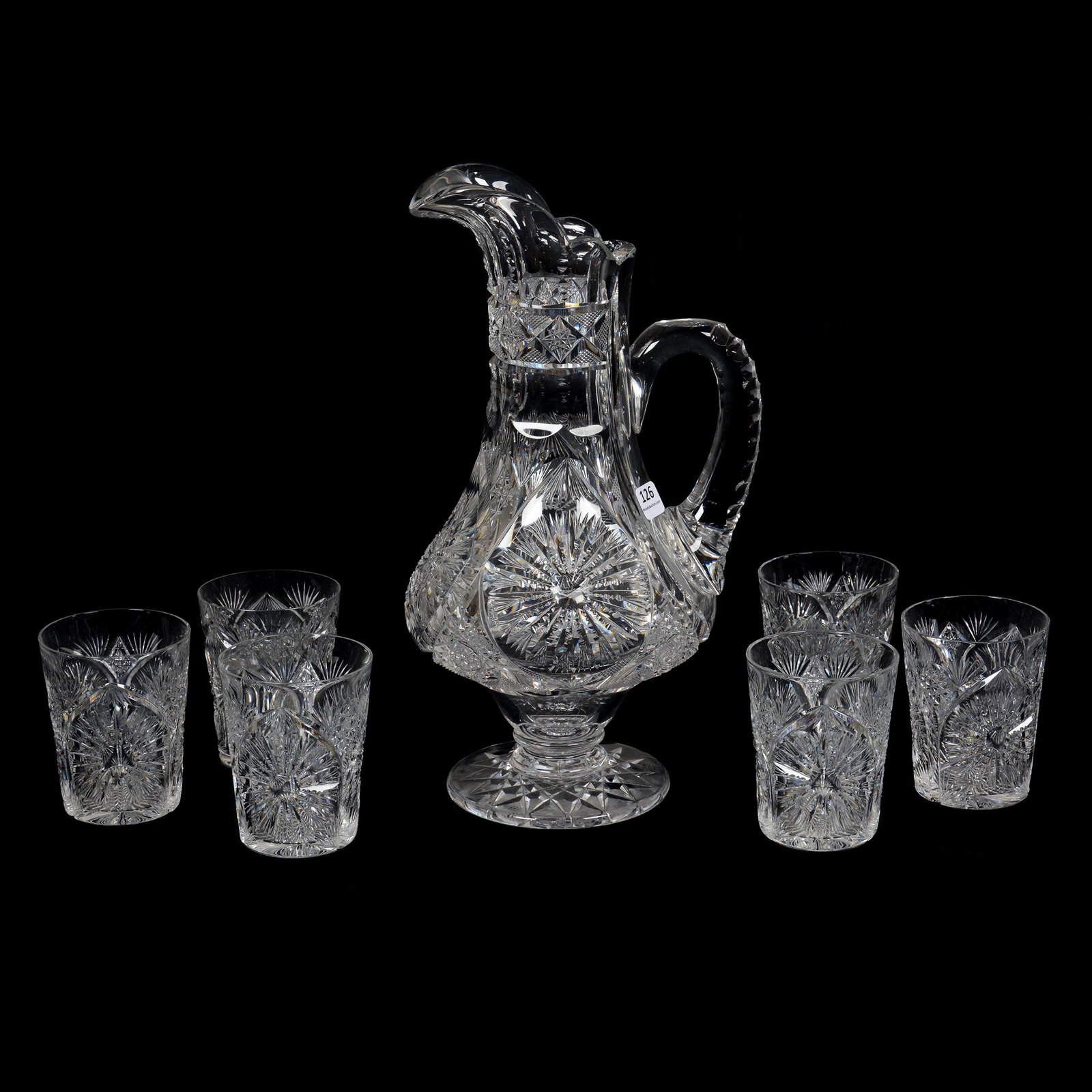 Pedestal Tankard Set, American Brilliant Cut Glass: Pedestal Tankard Set, American Brilliant Cut Glass, (1) 13.25" Tankard, Sunburst Pattern By Pitkin & Brooks, Triple Notched Handle, Hobstar Foot, Selling With (6) 3.75" Matching Tumblers, Beautiful Bl