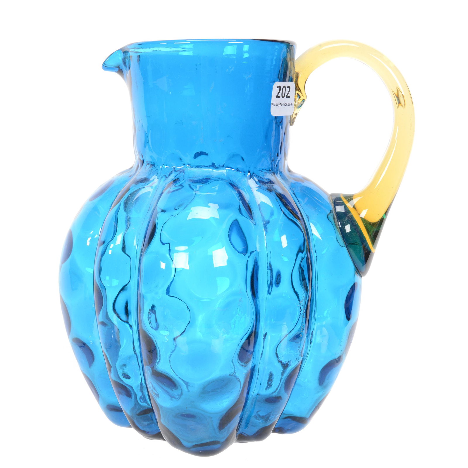 Water Pitcher, Blue Art Glass Coinspot: Water Pitcher, Blue Art Glass Coinspot, 8.5", Melon Ribbed, Four Sided, Applied Amber Handle, Polished Pontil Base, Nebraska Collection Of Ron & Pam Blessing