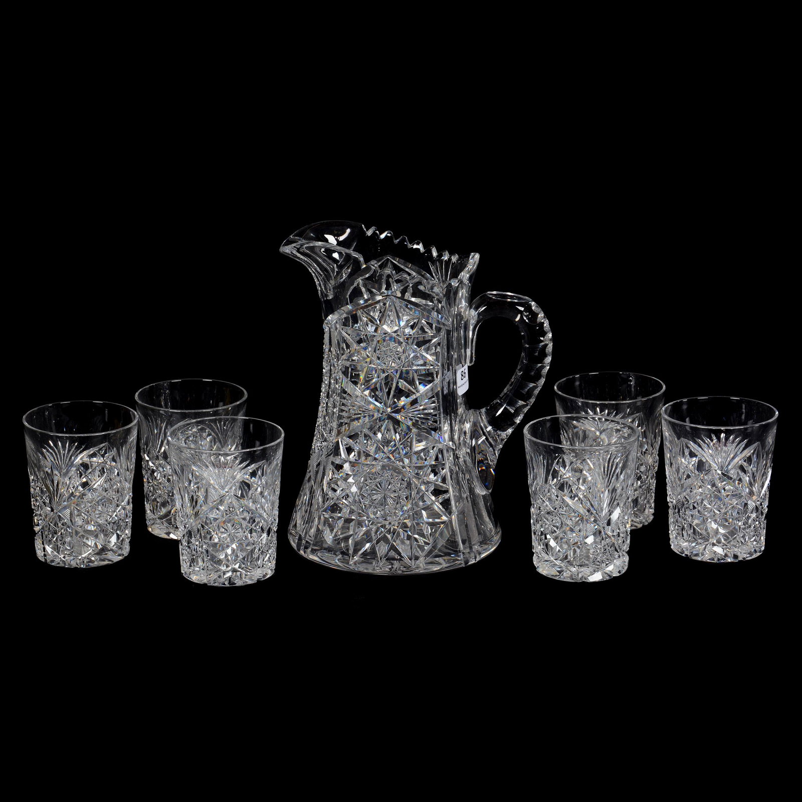 Water Set, ABCG, Signed Tuthill: Water Set, ABCG, Signed Tuthill, (1) 8.75" Pitcher, (6) Matching 3.75" Tumblers (2 With Base Chips), Features Hobstar, Cane, Strawberry Diamond And Fan Motif, Double Notched Handle, Ray Cut Base, Clea