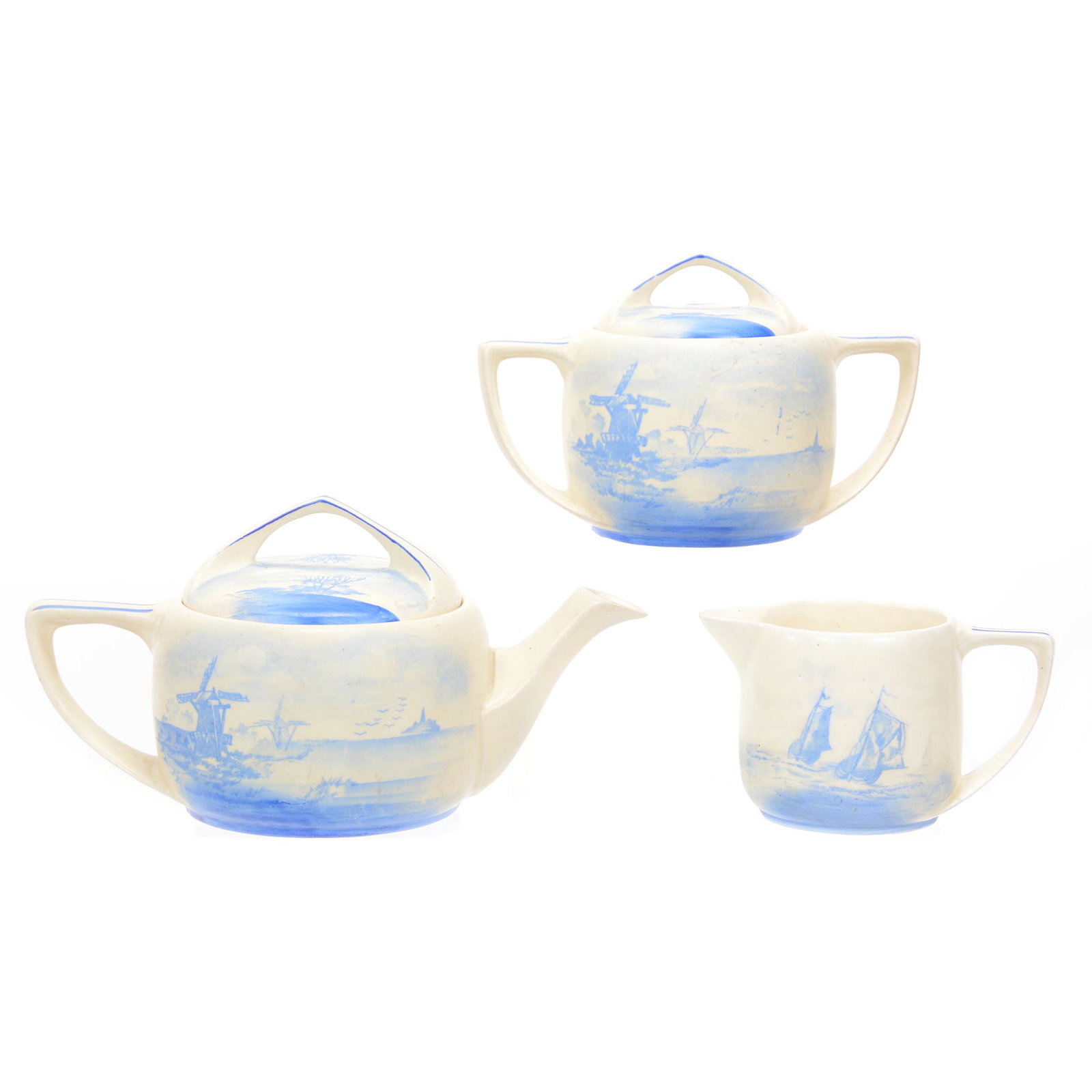 Tea Set, Unmarked Roseville Art Pottery Creamware: Tea Set, Unmarked Roseville Art Pottery Creamware, Scene Of Dutch Mill And Sailboat, Blue And White/Cream Tones (1) 4.75" X 9" Teapot, (1) 4.25" Covered Sugar, (1) 3" Creamer, Chip On Handle, Nice Set